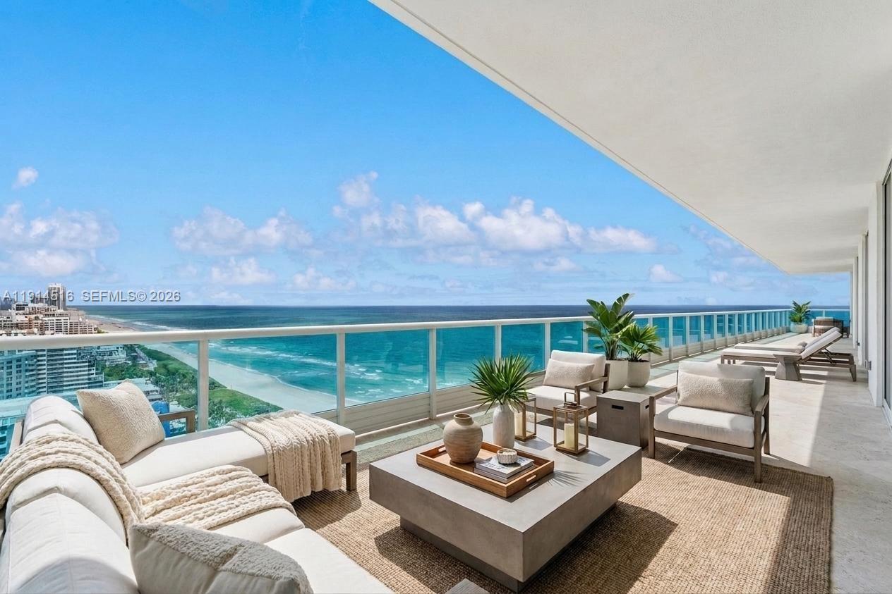 This exceptional penthouse offers remarkable space and ocean, city, and intracoastal views that fill every room. Adding to its scale, the property includes an oceanfront 1-bedroom cabana and 2 private guest quarters with ensuite baths. A private foyer, accessed by two elevators, opens into PH1, featuring 4 bedrooms, 4.5 baths, a den, and an additional office off the primary suite. The expansive primary bathroom includes his-and-hers walk-in closets and vanities, a separate shower, and a soaking tub facing Downtown Miami. A wraparound balcony spans the entire residence. The spacious kitchen offers a breakfast area and its own balcony. Located at Capobella, an exclusive boutique oceanfront building on Millionaire’s Row, the home also includes a dedicated laundry room and 5 parking spaces.