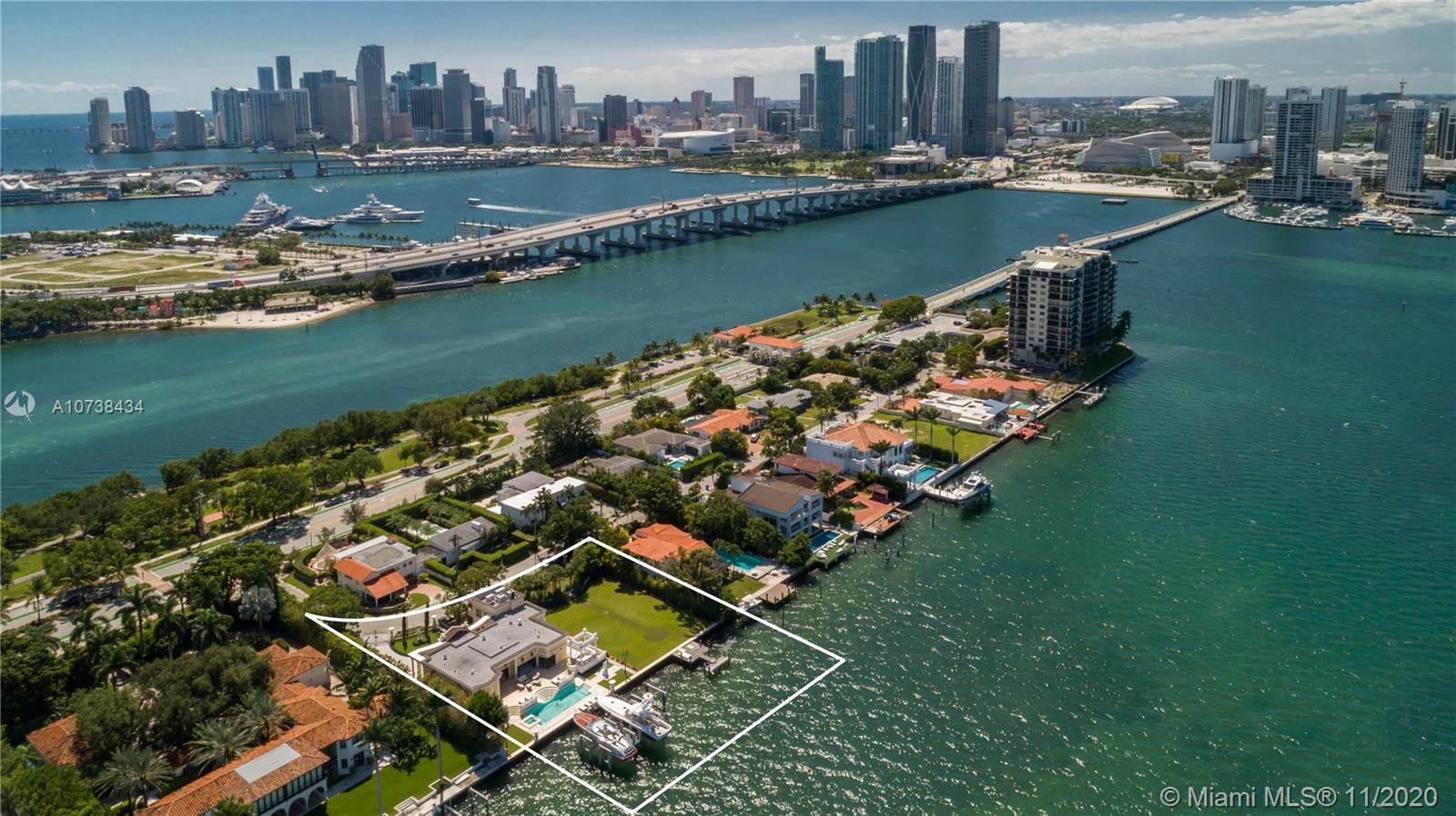 Magnificent Bayfront Villa- situated on a double lot offering 27,250 SF and 175 linear ft of Wide Bay waterfront. Elegant European home, designed by L. Carmellini of Milan (creator of Gianni Versace's boutiques and homes). The two-story residence offers unobstructed views of Biscayne Bay and Miami's skyline from most of the rooms. Carrara marble floors, exuberant wood work, gourmet kitchen, soaring coffered ceiling, formal dining room, large summer kitchen, over-sized mosaic swimming pool. Top of the line boat accommodations for large yacht or multiple elevated dockage. The residence is immaculate with no expense spared- move in condition. Rare opportunity to own one of the largest properties on the Venetian Isles.