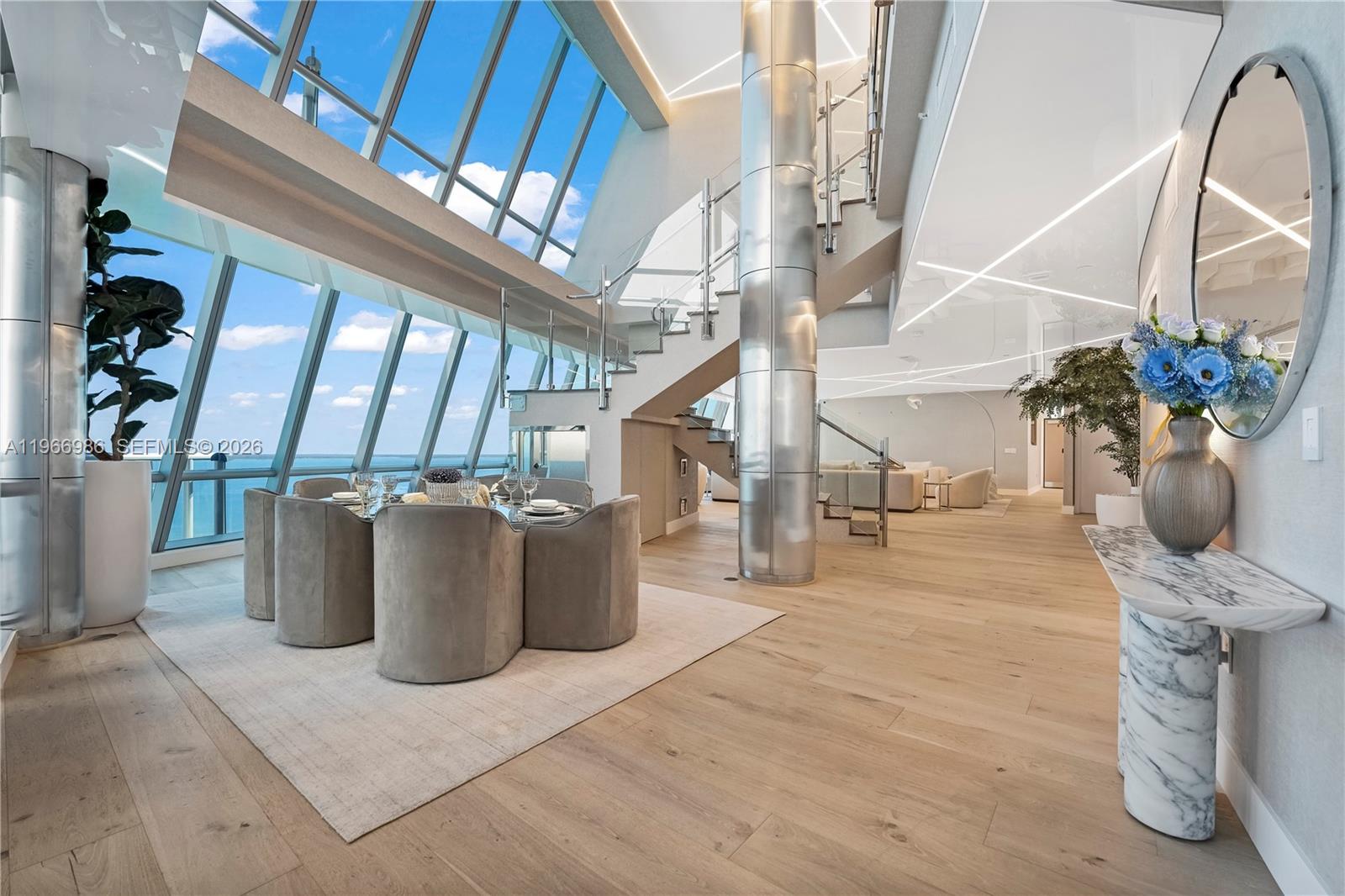 Experience unparalleled luxury in this renovated PH #4803 at Jade Ocean. Boasting 8,332 SF of interior living space, this 6 br, 7.5 ba residence truly lives like a private mansion in the sky. Private elevator opens directly into the unit. Designed for both grand entertaining and elevated everyday living, the home features expansive living + family rooms, along with a soundproofed studio/party room complete with its own bar. The primary suite is a retreat, featuring a dedicated movie room, gym, and sauna. Over $2 million in custom renovations showcase European white oak flooring, stretch ceiling upgrades, and designer lighting. 2,000 SF of terrace space with breathtaking 360 degree views of the Atlantic Ocean, beach, and Intracoastal. Assigned parking spaces Located in P3 #3065, #3044, #3066.
View Matterport tour for a detailed walkthrough of the property.