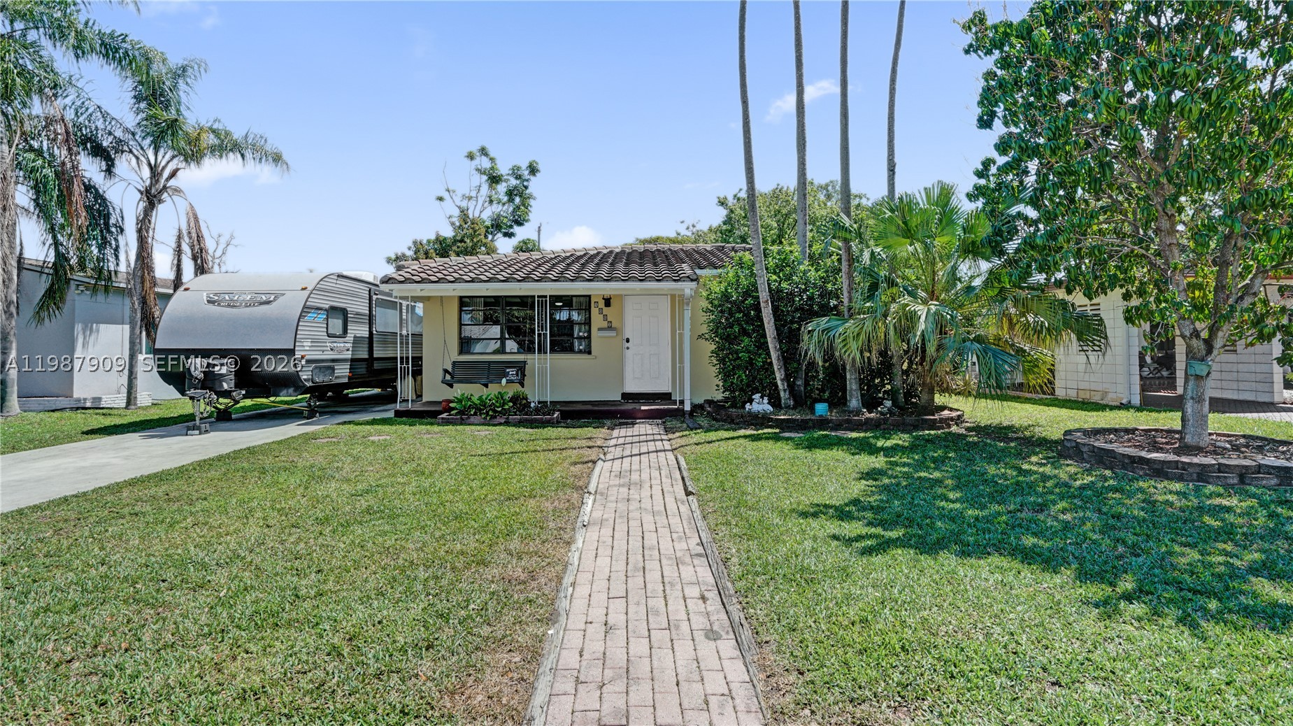 Charming 3-bedroom, 2-bath Hollywood home ideally located just a short bike ride to Hollywood Beach, Hollywood Blvd, the YMCA, Farmers Market, and TY Park. The spacious backyard is perfect for relaxing or entertaining, featuring plenty of fruit trees and an all-metal 10x16 ft Lark shed (2021). Inside, brand new vinyl flooring (2026) flows throughout, giving the home a fresh, modern feel. Enjoy year-round comfort with central AC (2021) plus a split unit in the primary bedroom (2024). The primary bathroom is fully upgraded (2022). A super long driveway offers ample space for an RV/boat and multiple vehicles. The house is connected to a gas line for added efficiency with a gas range and gas water heater. This well-maintained property is truly move-in ready! NO HOA, NO SEPTIC TANK