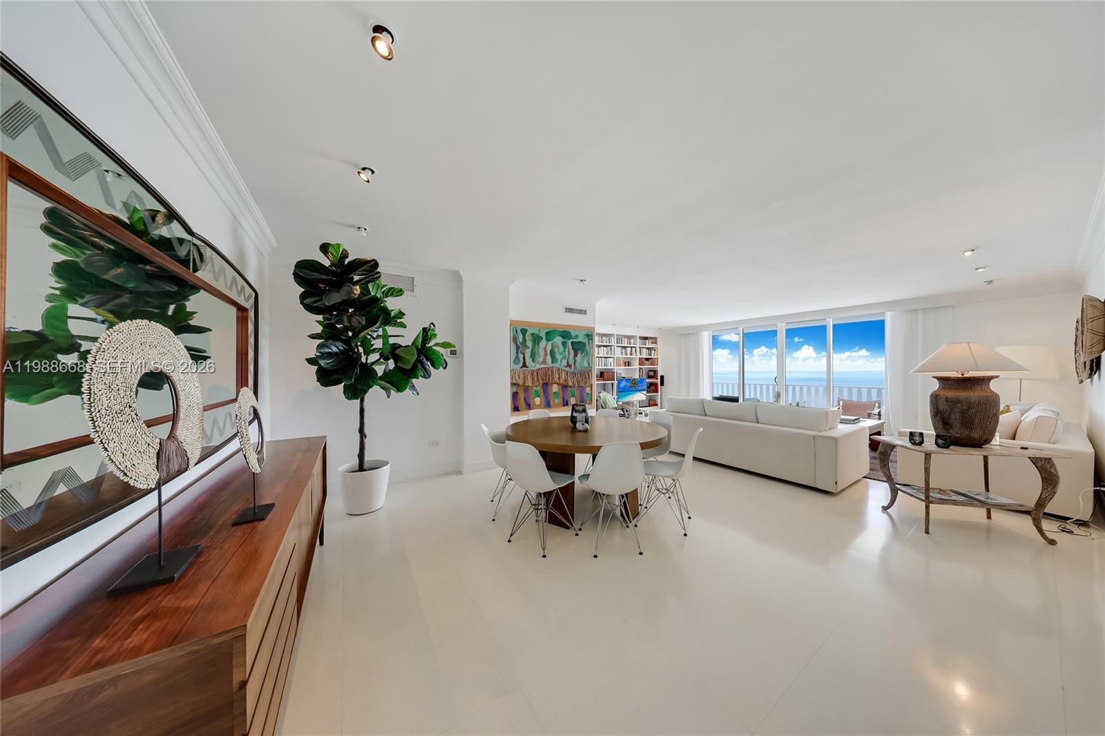From the moment you enter Residence 1102, the ocean unfolds in front of you. Positioned on a high floor within one of the building’s most desirable lines, this premium unit is distinguished by its elevation and its unobstructed views. Every room opens directly to the water and shoreline, offering a wide, continuous horizon. The living and dining area is both spacious and filled with natural light, extending seamlessly onto a full-length balcony that enhances the sense of openness. From here, the views are expansive and ever-changing, accompanied by the gentle sound of the ocean below.
Both bedrooms are oriented toward the water and feature en-suite bathrooms, offering privacy and comfort. The two bedrooms are framed by ocean-facing windows, creating a quiet, restful retreat. Walk-in closets in each bedroom provide ample storage and convenience. The kitchen, bathrooms, and flooring have been updated with clean, timeless finishes that complement the residence’s understated elegance. Impact windows throughout the building contribute an added sense of security and comfort. Residents enjoy direct beach access and a full suite of amenities, including a beachfront pool, heated pool, fitness center, 24-hour doorman, valet service, and beach chair and umbrella service. Residence 1102 is a rare opportunity to own a premium oceanfront home in one of the most desirable buildings in Key Biscayne.