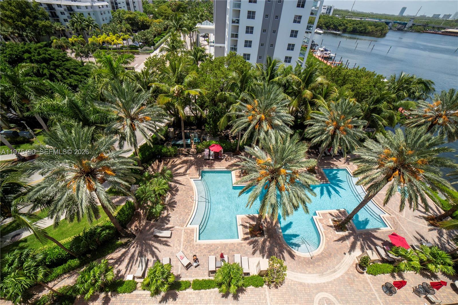 Beautifully upgraded 2-bedroom, 2-bath lower penthouse in the heart of Sunny Isles Beach, featuring southern exposure, tile flooring, in-unit laundry, and an open-concept kitchen. The spacious primary suite offers a large bathroom with double sinks, a linen closet, and a walk-in closet, while the balcony provides partial bay and city views with space to dine or unwind. Enjoy resort-style amenities at Porto Bellagio, including two pools, a jacuzzi, a new gym, clubhouse, private promenade, and more. Covered, assigned parking included. Walking distance to the beach, shops, restaurants, and a top-rated K–8 school. Pet-friendly community.