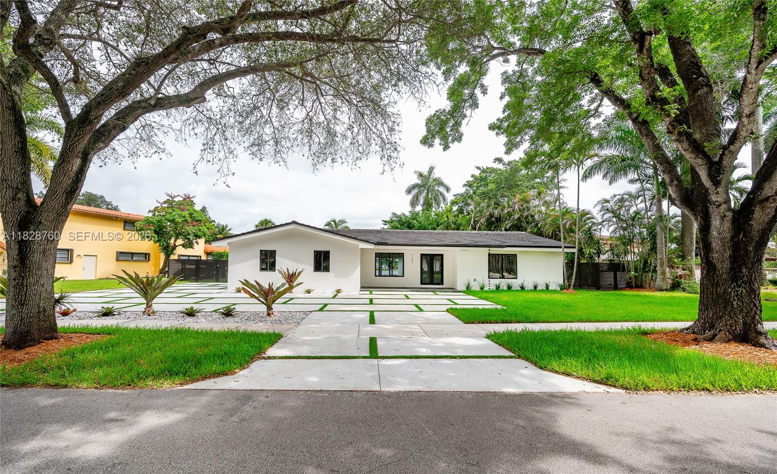 Beautiful and updated lakefront home in Loch Lomond, a gated community with a guard at the entry, surrounded by the NEW Miami Lakes Golf Course. Features 4 bedrooms, 4 bathrooms, a pool, 2-car garage, and impact windows/doors offering amazing lake and pool views. Recently updated plumbing, windows, doors, kitchen, bathrooms, and a modern circular driveway. All building permits are closed and finalized. The large primary suite boasts stunning lake views and a walk-in closet with custom cabinetry. The large, 16,306 sq ft fenced lot includes a golf putting green overlooking the pool. Great price per sq ft for an updated home in this Loch Lomond gated community in Miami Lakes. Note: Furniture, 2 pergolas, and outdoor kitchen are virtual photos, not included in this sale.