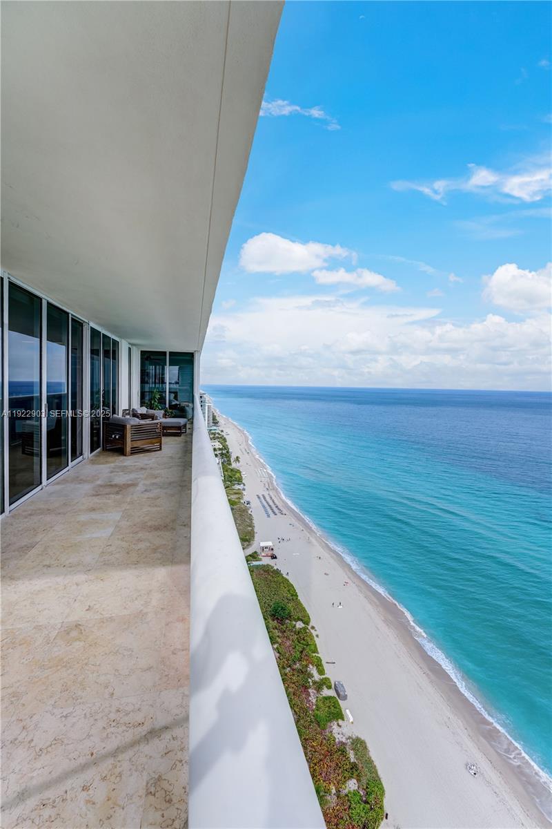 Experience breathtaking direct, unobstructed ocean views from this stunning 30th-floor residence at Beach Club Tower. This high-floor unit offers floor-to-ceiling impact glass, a spacious open layout, and a private balcony overlooking the Atlantic, perfect for sunrise mornings and relaxing evenings. Enjoy a modern kitchen with premium appliances, elegant finishes, and resort-style amenities including pools, spa, fitness center, beach service, and valet. Located minutes from Bal Harbour, Aventura Mall, fine dining, and nightlife. The ideal oceanfront lifestyle in Hallandale, move-in ready and priced to sell. Most desirable line in the three towers!