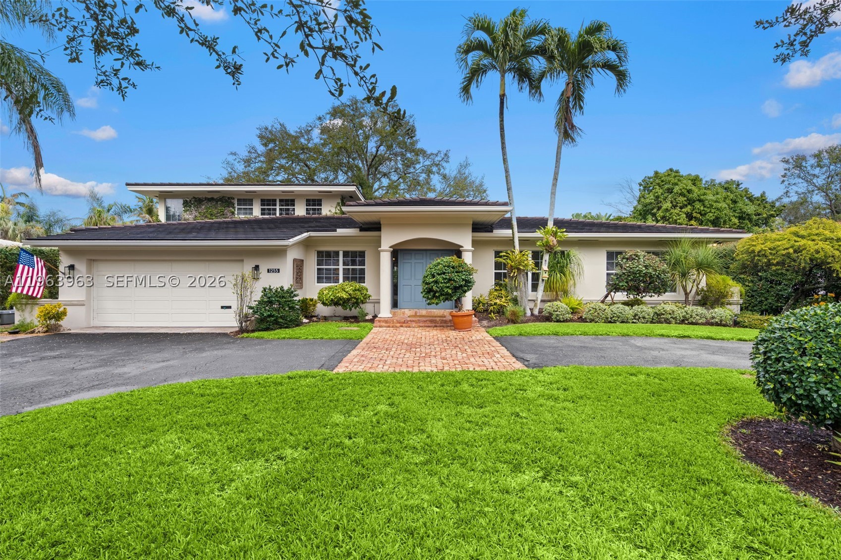 Beautifully maintained and thoughtfully designed, this inviting residence offers soaring double-height ceilings in the family room, creating a bright and open ambiance, while a fireplace anchors the living room with warmth and charm. Rich wood and marble floors run throughout, blending timeless elegance with everyday comfort. The home has 4 bedrooms, The first floor has 3 spacious bedrooms and 3 full bathrooms, while the private upstairs primary suite serves as a serene retreat complete with a sitting area, spa-inspired bath, and generous walk-in closets. Designed for effortless indoor-outdoor living, the brick patio and covered terrace overlook the pool, creating an ideal setting for entertaining. Speakers in the main living areas and outdoors enhance the experience. Additional highlights include  double-pane windows, a generator, built-in garage workstation, exterior storage closet, and sprinkler system. A refined and functional home ready for its next chapter.