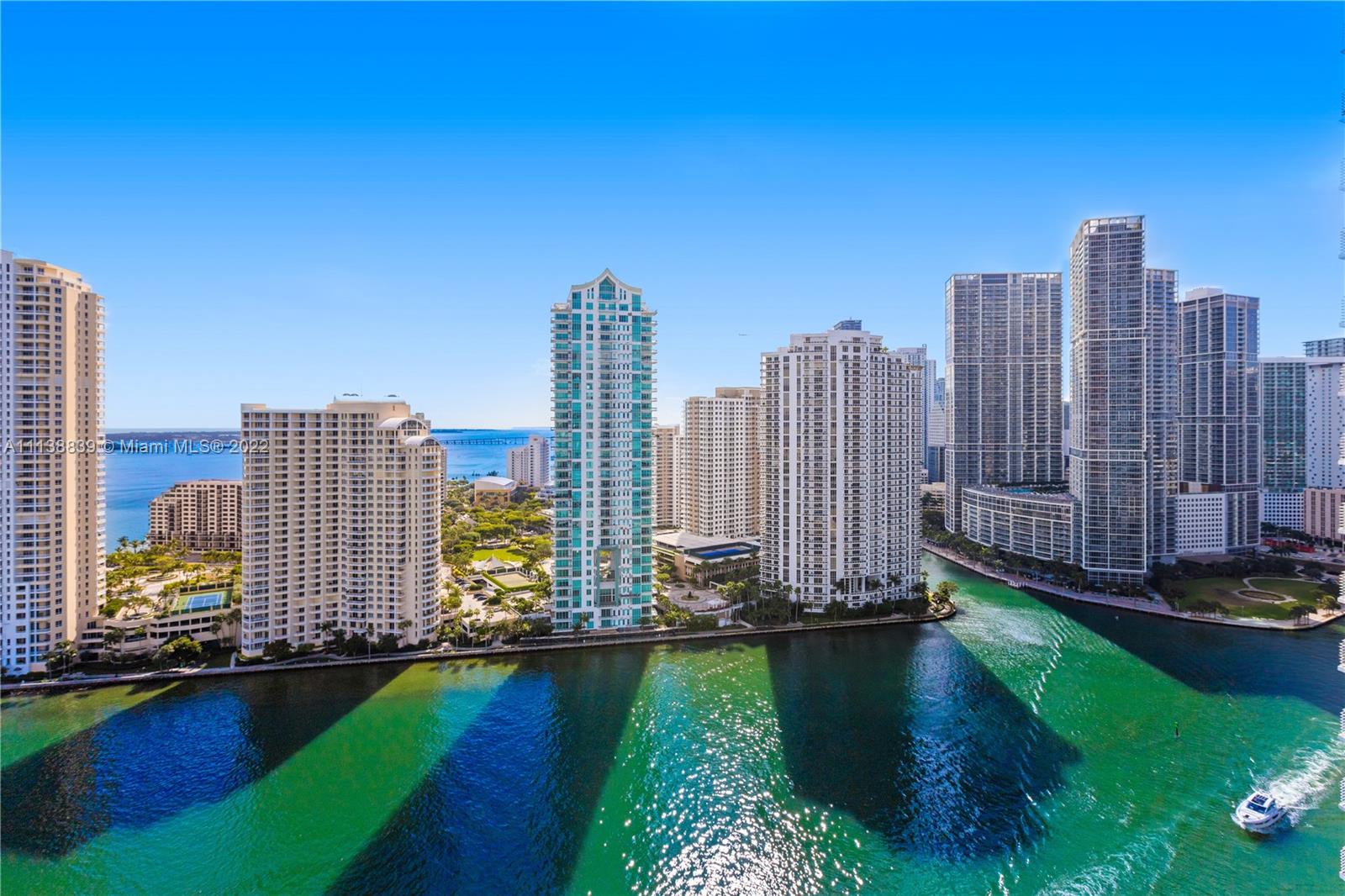Beautiful 1 bedroom 1 bath condo overlooking Biscayne Bay, Miami River, and Brickell Skyline. Live in luxury with wood floors throughout, Italian kitchen cabinets, with granite countertop and stainless steel appliances, and marble top bath. Bldg amenities incl: 2 swimming pools, Jacuzzi, 2 Fitness Centers, 2 Party Rooms, Conf. Rm., Convenience Store, and 24 hours Security, Valet, and Concierge. Centrally located within minutes to SoBe, Grove, Gables, Airport, and Design District.