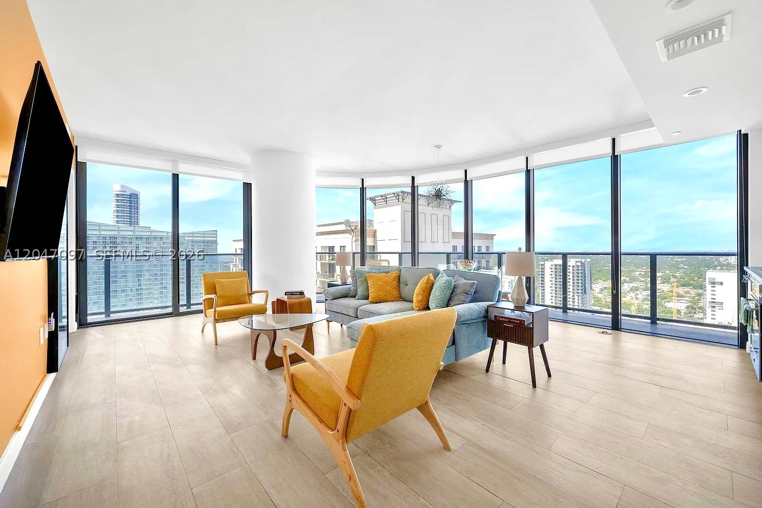 Experience stunning sunrise-to-sunset views from this fully furnished, high-floor corner residence in the heart of Brickell. This 2-bedroom + den, 2-bathroom unit offers 1,053 SP of modern living space with a spacious split floor plan, floor-to-ceiling impact windows, and a wraparound balcony. Move-in ready and fully equipped, including glassware, tableware, cookware, silverware, and all essentials. Just bring your suitcase. The primary suite features a king-size bed and a spa-style bathroom with soaking tub, walk-in shower, and double vanity. Interior highlights include European cabinetry, GE Monogram appliances, imported porcelain tile floors, and 9 ceilings. Residents enjoy resort-style amenities, including a rooftop sky pool and a full-service spa with a sauna, steam room, and jacuzzi.