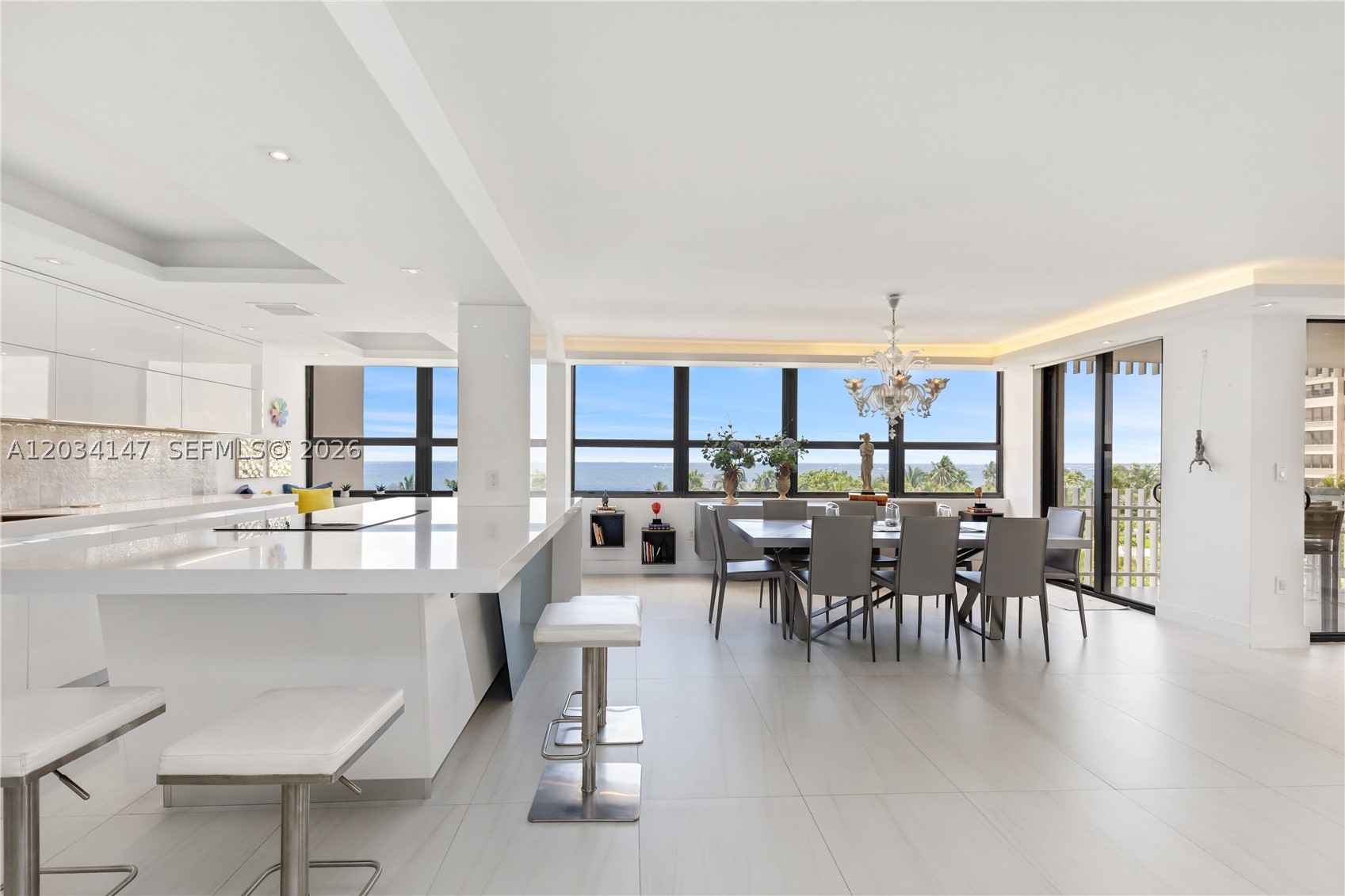 COCONUT GROVE private Island "GROVE ISLE" THIS UNIT OFFERS UNOBSTRUCTED DIRECT OCEAN AND BAY VIEW FROM ITS TWO OPEN BALCONY!!! featuring spectacular sunrise and sunset vistas. FULLY RENOVATED!!! Located on the 5th floor, allows you to admire the beautiful green landscaping and enjoy the water views . The modern space features a High-end Italian kitchen with premium appliances. Finished with elegant Spanish Tiles in living areas and bathrooms. Bright and filled with light throughout. Brand New Tennis Club. This is resort style at its finest!!Don't miss the opportunity to enjoy this exceptional resident.
