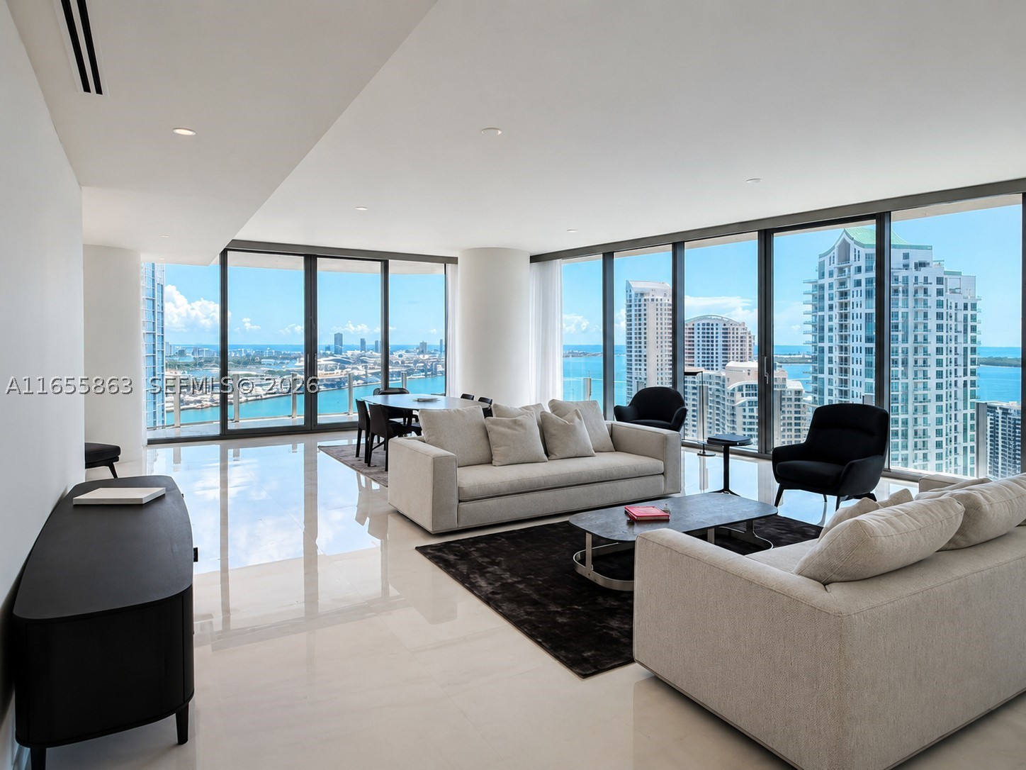 Aston Martin Residences Miami is a luxury residential tower located at 300 Biscayne Boulevard Way. Developed by G and G Business Developments, this 65-story skyscraper features 391 high-end condominiums with designs inspired by the iconic Aston Martin brand. Residences offer expansive layouts, floor-to-ceiling windows, and top-tier finishes. Amenities include a private marina, a state-of-the-art 2 floor wellness center, a sky deck with a pool, and more. The building’s sleek, modern design and prime waterfront location make it a prestigious address in Miami’s vibrant downtown area.