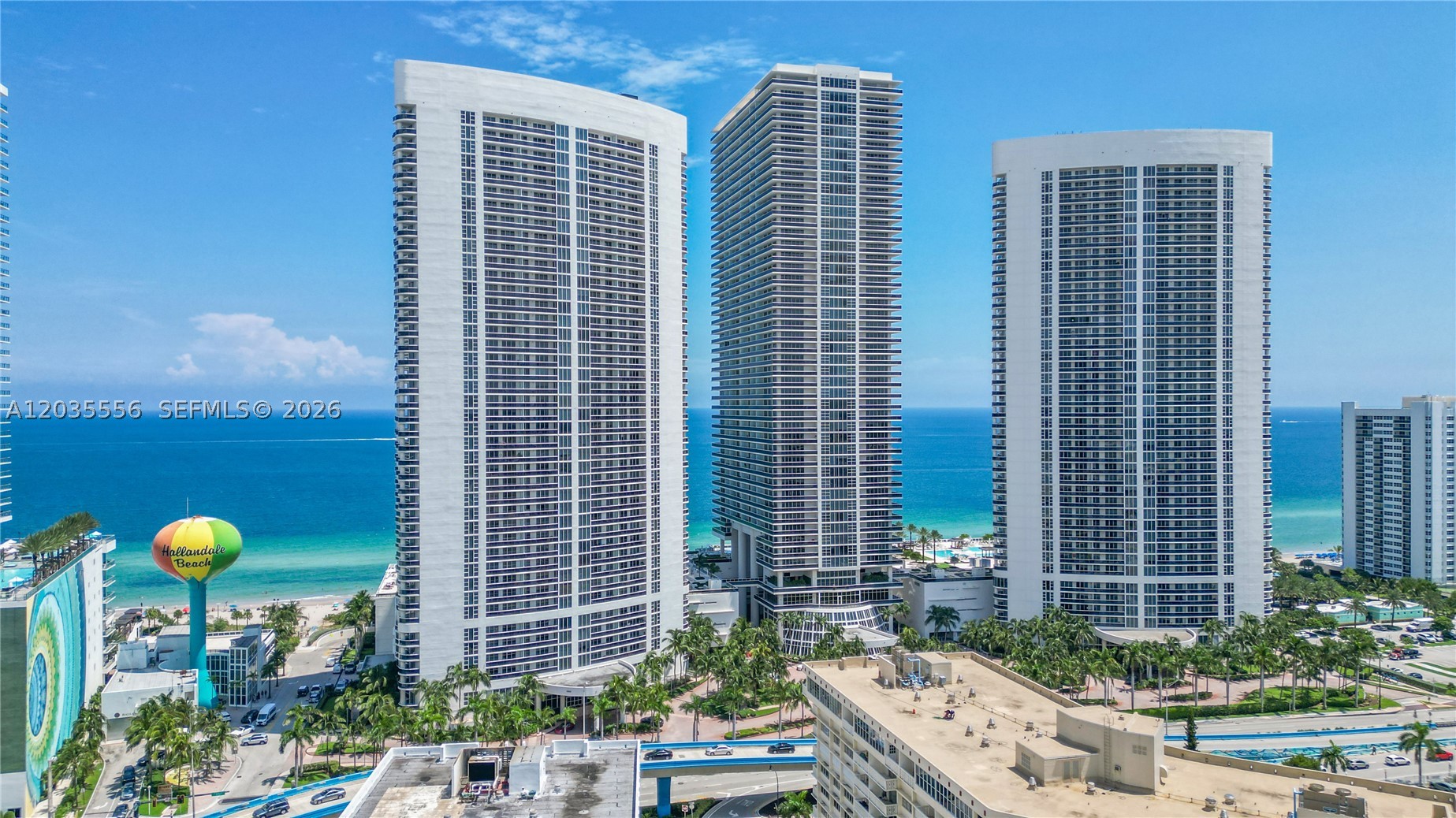 Soaring 45 stories above Hallandale Beach, this impeccably decorated 2-bedroom + enclosed den, 2-bath residence offers a 264 sq.ft. balcony with panoramic ocean and Intracoastal views. Elegance abounds with marble floors, custom wood doors, built-in closets, and a European-style kitchen with premium appliances and granite countertops. Indulge in The Beach Club’s world-class amenities: concierge, valet, beach service, six pools, bar, restaurant, and a 50,000 sq.ft. oceanfront spa and fitness center. Ideally located near Gulfstream Park, Hollywood Boardwalk, Bal Harbour, South Beach, and Las Olas. “Investor friendly. Unit can be rented 12 times per year”