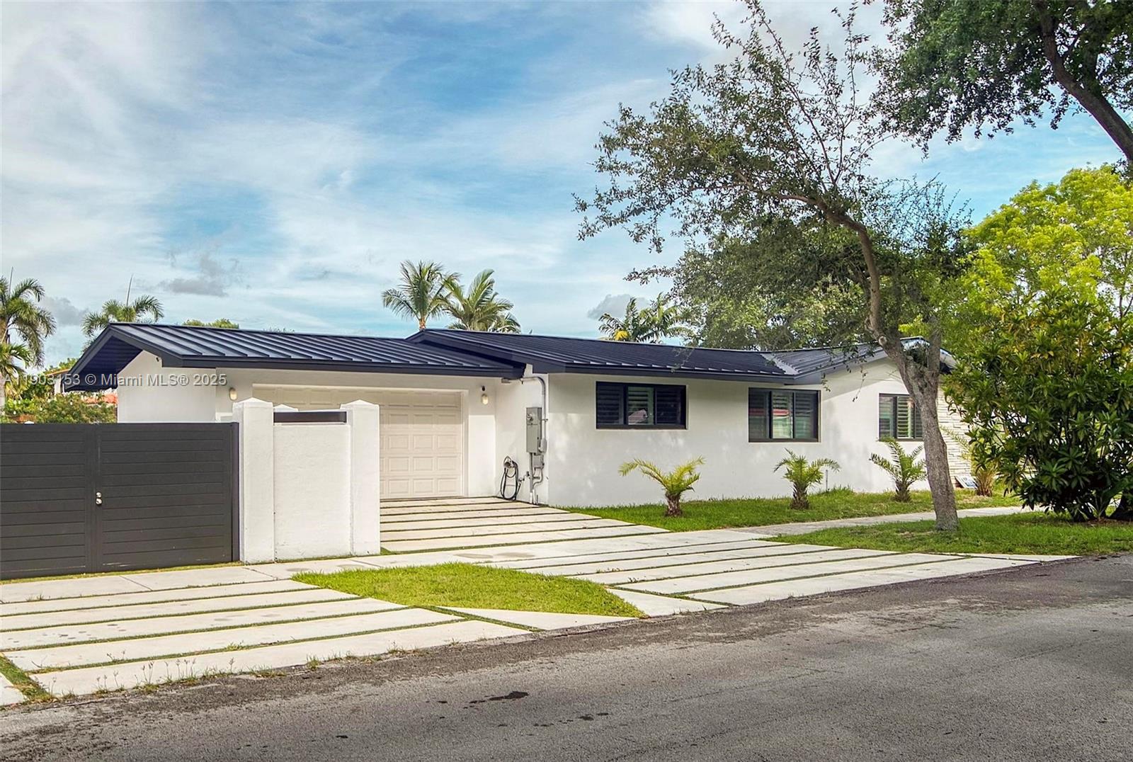 Welcome to this masterfully renovated 4 bedroom, 3 bath pool home in the heart of Miami Shores. Offering over 2600 SF of refined living designed for the discerning buyer, it features formal living/dining areas, a chef’s kitchen with marble island, custom cabinetry, and premium appliances. The split-bedroom layout includes a luxe primary suite with dual walk-in closets and a spa-style bath. Enjoy impact windows/doors, steel roof, LED lighting, Italian porcelain floors, and new fencing. Nestled in a close-knit neighborhood near top magnet schools, this turnkey gem blends timeless elegance with modern comfort.