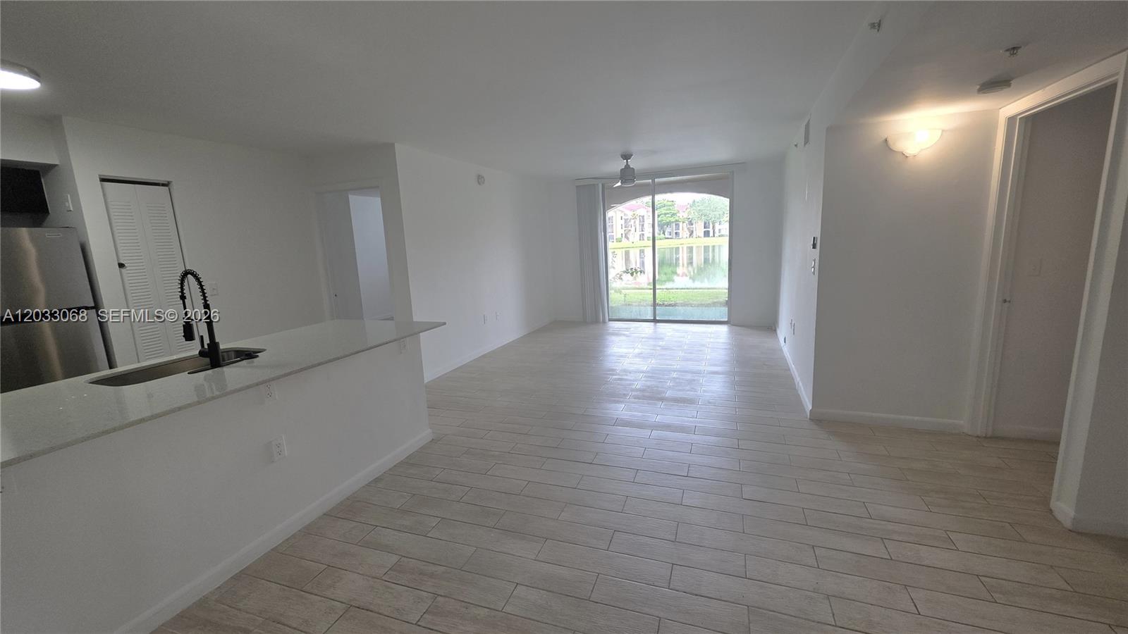 Beautifully updated first-floor condo featuring lake views from every room! This split-floorplan offers two spacious suites, a new kitchen with extended granite counters, modern bathrooms, new tile flooring, and stainless steel appliances. Located steps from the clubhouse and pool, Enclave at Miramar offers resort-style amenities: tennis courts, a heated pool with a hot tub, new gym, racquetball, sauna, sand volleyball, car wash station, jogging trails, and gated play areas. Perfectly situated near the Turnpike & I-75, close to shops, dining, and entertainment. No pet restrictions. No rental restrictions