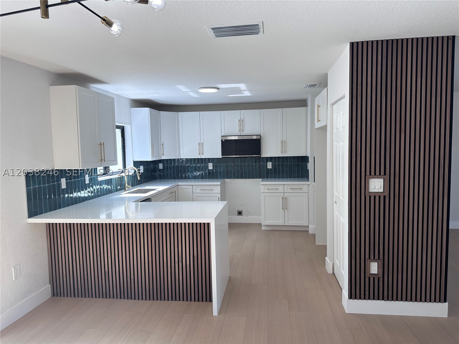 Beautifully remodeled 4-bedroom, 2-bathroom move-in ready home featuring insurance-friendly upgrades, including a brand-new roof, impact windows, and impact doors for added safety and peace of mind. The stunning kitchen boasts quartz countertops, new appliances, and modern finishes throughout. Both bathrooms have been tastefully renovated with elegant details and quality craftsmanship. No expense was spared in the renovation, with thoughtful updates and fine finishes designed to impress today’s buyers. The spacious backyard offers plenty of room to add a pool and create your own private outdoor oasis. Every aspect of this home has been carefully updated and maintained. NO HOA! Competitively priced for a quick sale—don’t miss this exceptional opportunity!