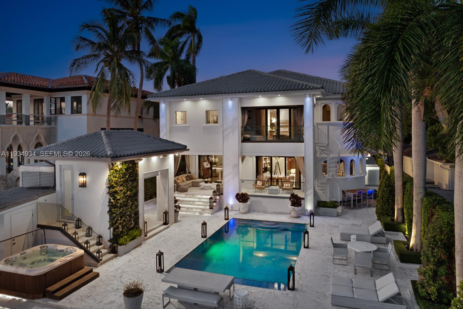 Welcome to luxury waterfront living at 176 S Hibiscus Drive in the heart of Miami Beach! This stunning 6-bed, 6.5- bath residence offers 60 feet of prime waterfront on one of the most prestigious islands in Miami Beach, with breathtaking views of downtown Miami. Equipped with two boat lifts—one holding 40,000 pounds & the other 20,000 pounds—a private dock,& summer kitchen, this home is a boater’s dream. A generator that powers the entire home. Inside, the high-end finishes & smart home technologies are evident. Mia Cucina kitchen is a chef’s delight, complemented by an elegant bar, & wine cellar. Unparalleled convenience, comfort,& security. Located on the prestigious Hibiscus Island, enjoy the best of Miami Beach living—close to world-class shopping, dining, & entertainment.