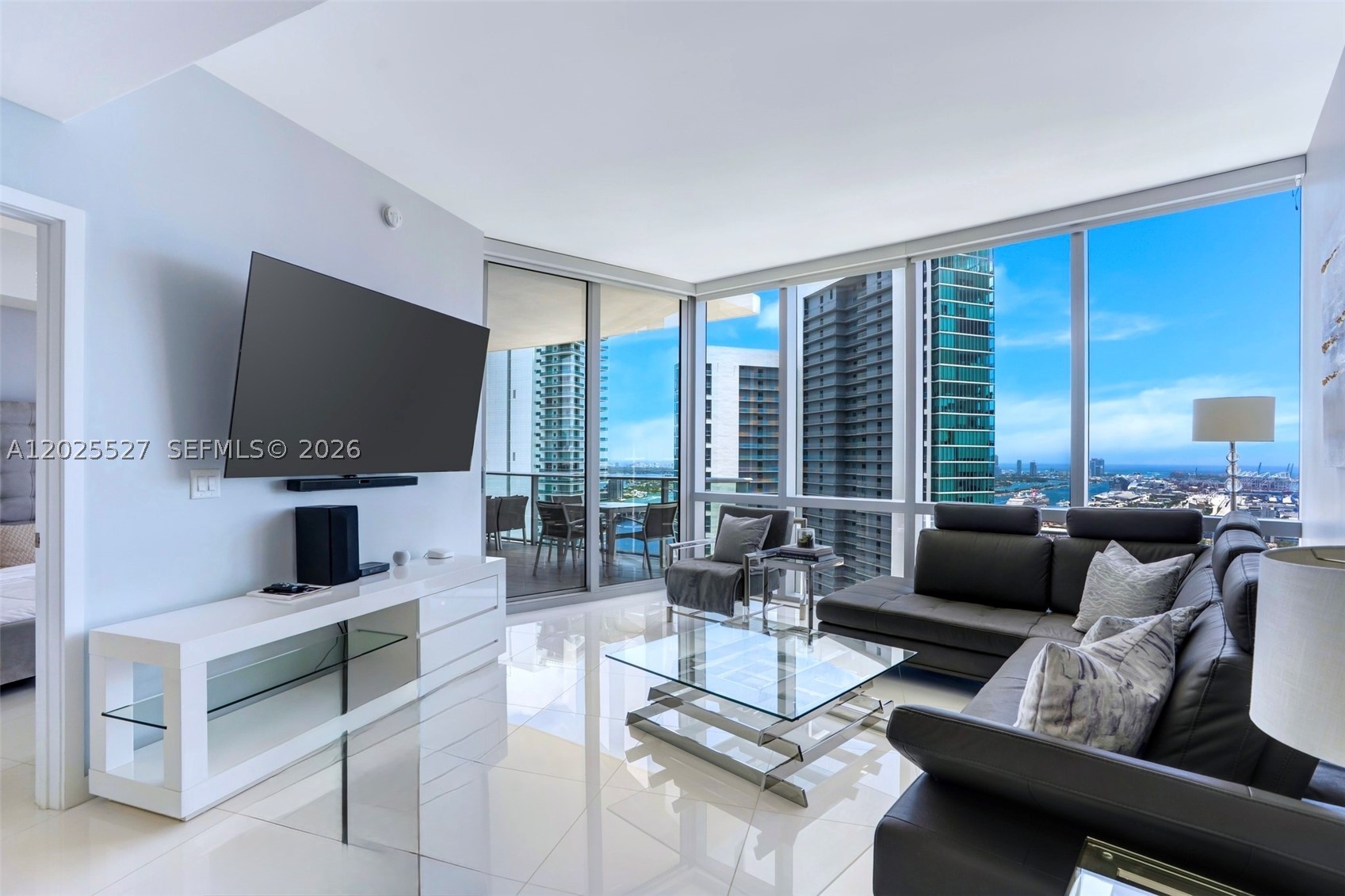 Welcome to Paramount Miami Worldcenter—home to the most amenities in the world. The highly desired 09' line, 2-bed, 3-bath plus den residence on the 39th floor features 10 ft. floor-to-ceiling windows showcasing stunning Bay, Intracoastal, and Miami skyline views. Private elevator access opens to a foyer leading to a large open living room, split-bedroom layout and flexible den. The European-style kitchen offers custom cabinetry, a waterfall island, and Sub-Zero/Bosch appliances. Upgrades include automatic blinds throughout, custom built closets, and new lighting. Primary suite includes a spa-like bath with dual vanities, soaking tub, and glass shower.  Fully Furnished with a modern touch completes this turn key ready rental, just bring your suitcases!  
Enjoy unmatched amenities: five pools, spa, lounges, summer kitchen, fitness center, boxing and yoga studios, racquetball, basketball, observatory, jam/recording studios, kids’ room, virtual golf, soccer field, sky deck, rooftop pool, plus 24/7 front desk and valet. Located in Miami Worldcenter, the country’s second-largest master-planned community with dining, shopping, and entertainment. Flexible living can be rented up to four times per year—ideal for both end-users and investors.