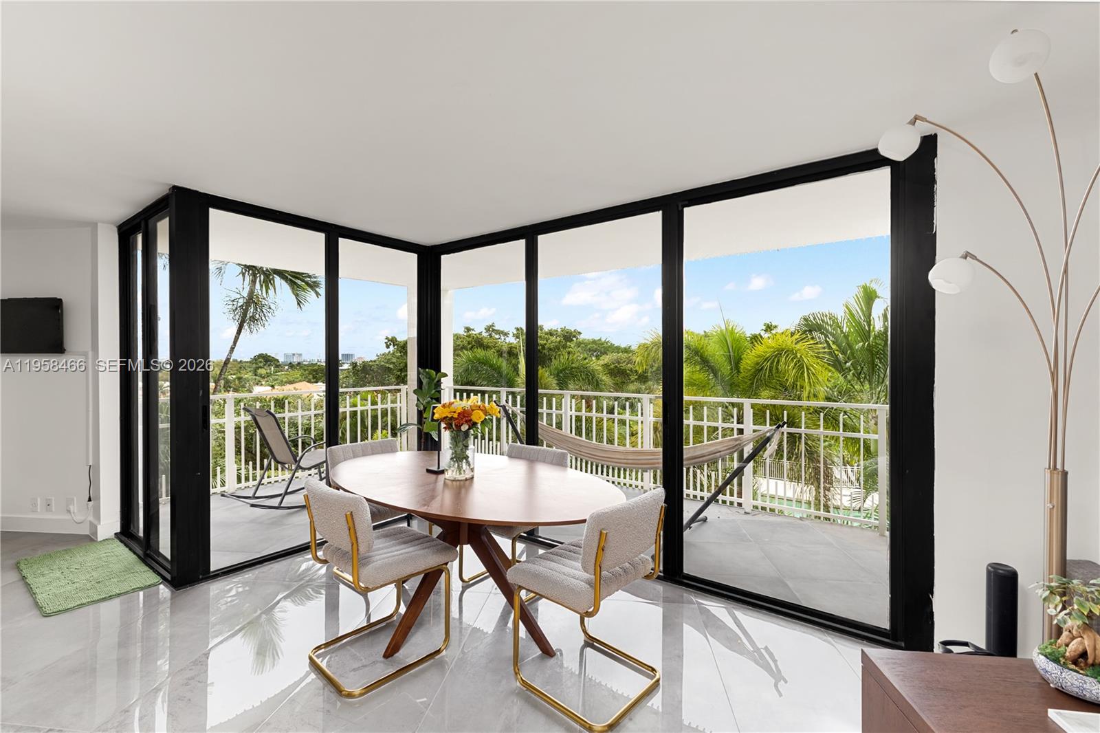 Sellers have been relocated by employer-extremely motivated– priced at a loss to them for an amazing deal for you! Over 1500 ft.² w/oversized balcony on premier side of bldg w/treetop & water views. Completely remodeled split floor plan w/floor to ceiling windows & doors, gorgeous chef's kitchen w/quartz countertops, formal dining or a great office area, & porcelain tile floors. Primary suite w/spa-like bath w/double sinks, large seamless glass shower, & walk-in closet. Large guest suite w/full bath, in unit washer dryer- has it all including 2 parking spaces & extra storage. In incredible 33 acre gated resort-style complex w/amazing amenities & grounds (pools, spa, tennis -too many to list). Bldg just completed 40 year recert & has full reserves. Miami living doesn’t get any better than this!