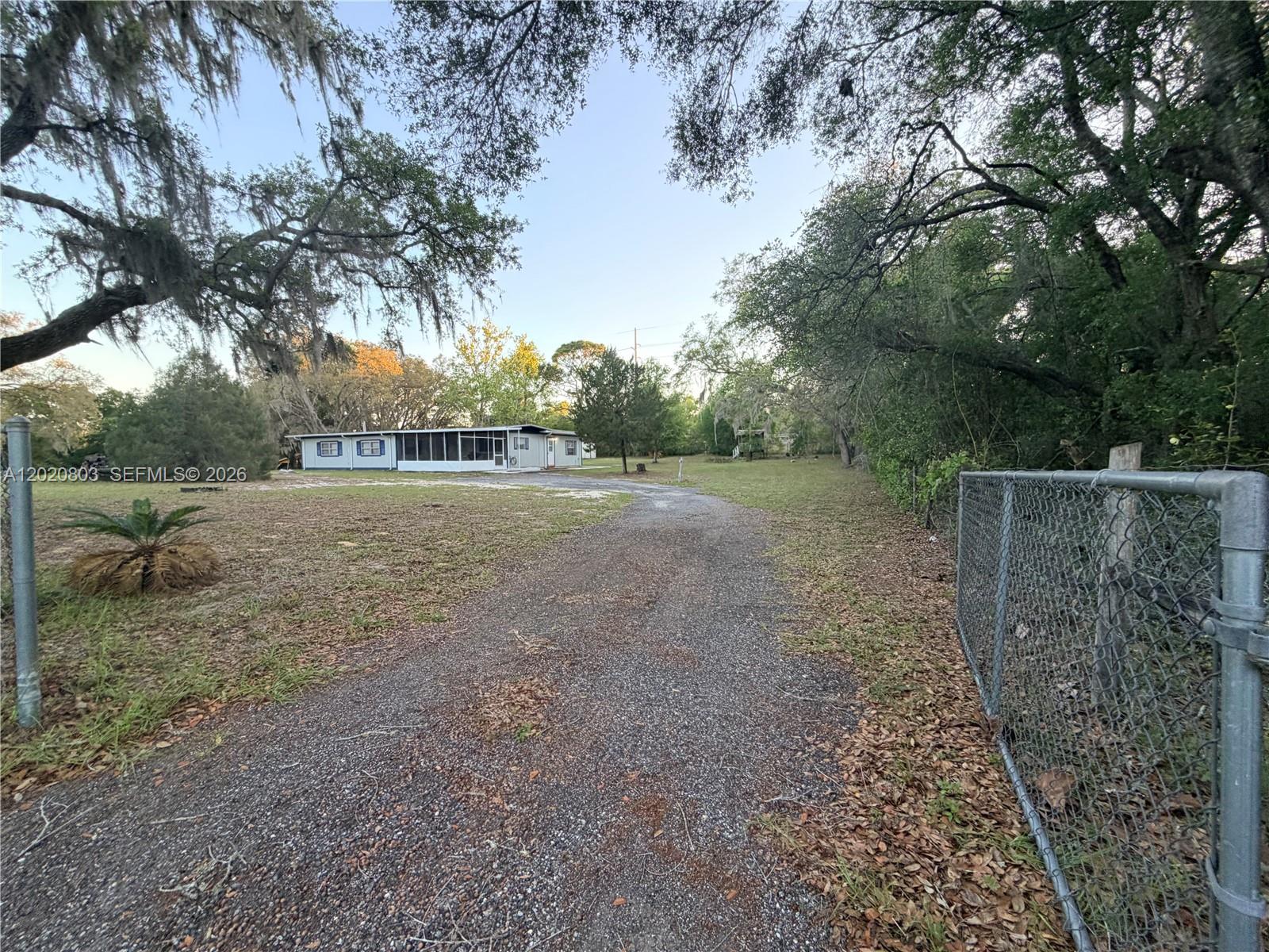 Move-in ready and packed with over $100,000 in upgrades, this beautifully updated home on 1.25 acres offers the perfect blend of modern comfort and peaceful living in Hernando. Featuring a large workshop, fully fenced property, and cleared land, this home is ideal for those seeking space and functionality. MINUTES FROM LOCAL SHOPS, COFFEE & RESTAURANTS. Great home or Investment Property! Major improvements include 2022 updates such as a NEW ROOF all new FLOORING, LIGHT FIXTURES interior PAINT. In 2023 upgrades include an UPGRADED Frigidaire and Samsung stainless steel APPLIANCES and range hood. In 2024, the exterior was freshly painted, NEW GUTTERS were installed, and a MILLINGS DRIVEWAY was added. Recent enhancements include a NEW SPLIT UNIT and upgraded 220-AMP RV/Tesla hookup, along with a SMART THERMOSTAT, electrical plate updates, and screened lanai improvements (2026). 
Enjoy added features like a new entry gate and modern lighting throughout. Located in a FEMA X zone and ideally situated near the Withlacoochee State Trail, as well as Crystal River and the World Equestrian Center, this property offers a quiet lifestyle with convenient access to outdoor recreation and everything Citrus County has to offer.