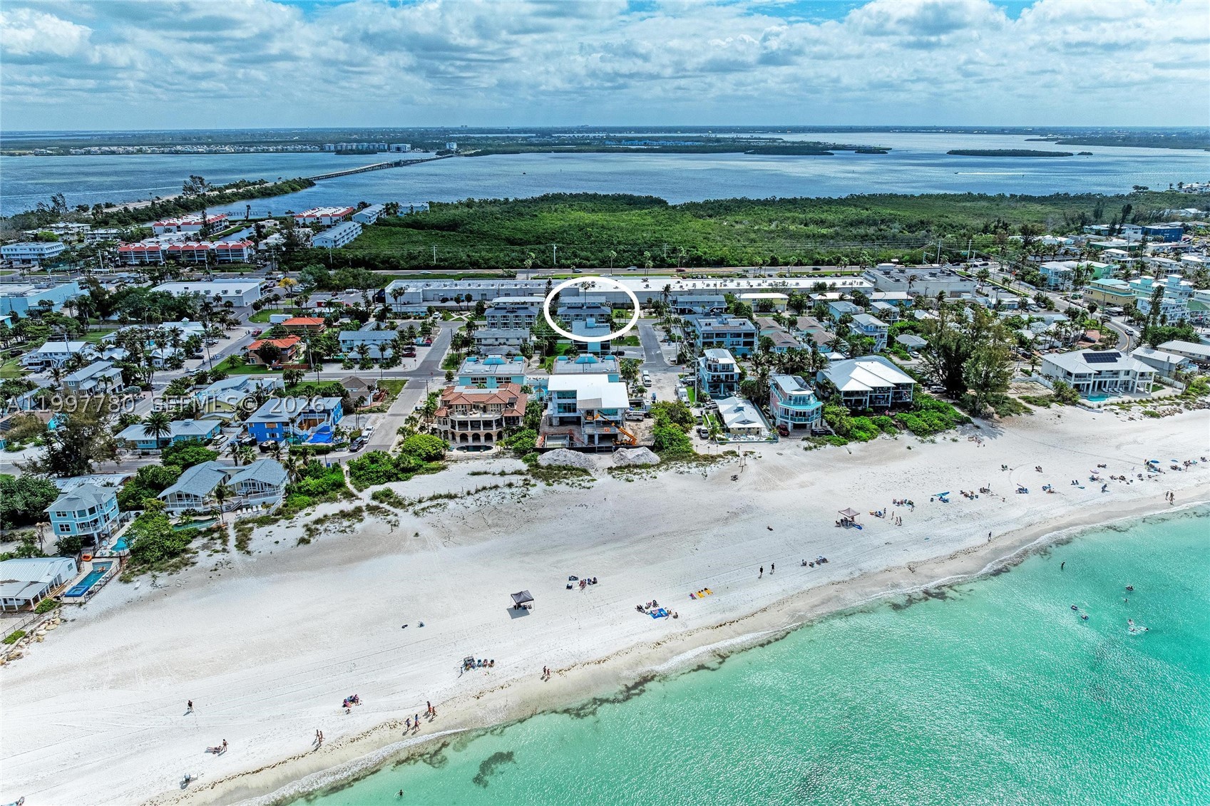 Turn-key furnished 2BD/2BA condo located directly across the street from the white sandy beaches of Anna Maria Island in Holmes Beach. This 1,569 sq ft TA unit offers a desirable two-level layout with living areas on the main level and bedrooms upstairs, each with its own private balcony. Open kitchen with island flows into a bright living space. Ceramic tile flooring throughout main areas. Community features a recently remodeled pool and fenced green area. Ideally located near restaurants, grocery stores, pharmacies, and shopping. Short-term rentals allowed, making this an excellent income-producing opportunity or perfect island getaway. Enjoy the charm of Anna Maria Island, known for its beautiful sunsets and relaxed coastal atmosphere, offering a wonderful setting to unwind and spend quality time by the beach.