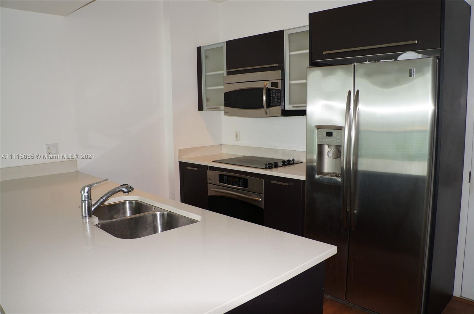 Spacious 1 Bedroom in High Floor with Open City Views and some Bay Views. Northern Exposure. Full Amenity building in the center of Edgewater. Walking Distance from Restaurants and Shops. Covered Parking Space, new oversized washer and dryer and no pet restrictions. Vacant and Easy to Show.