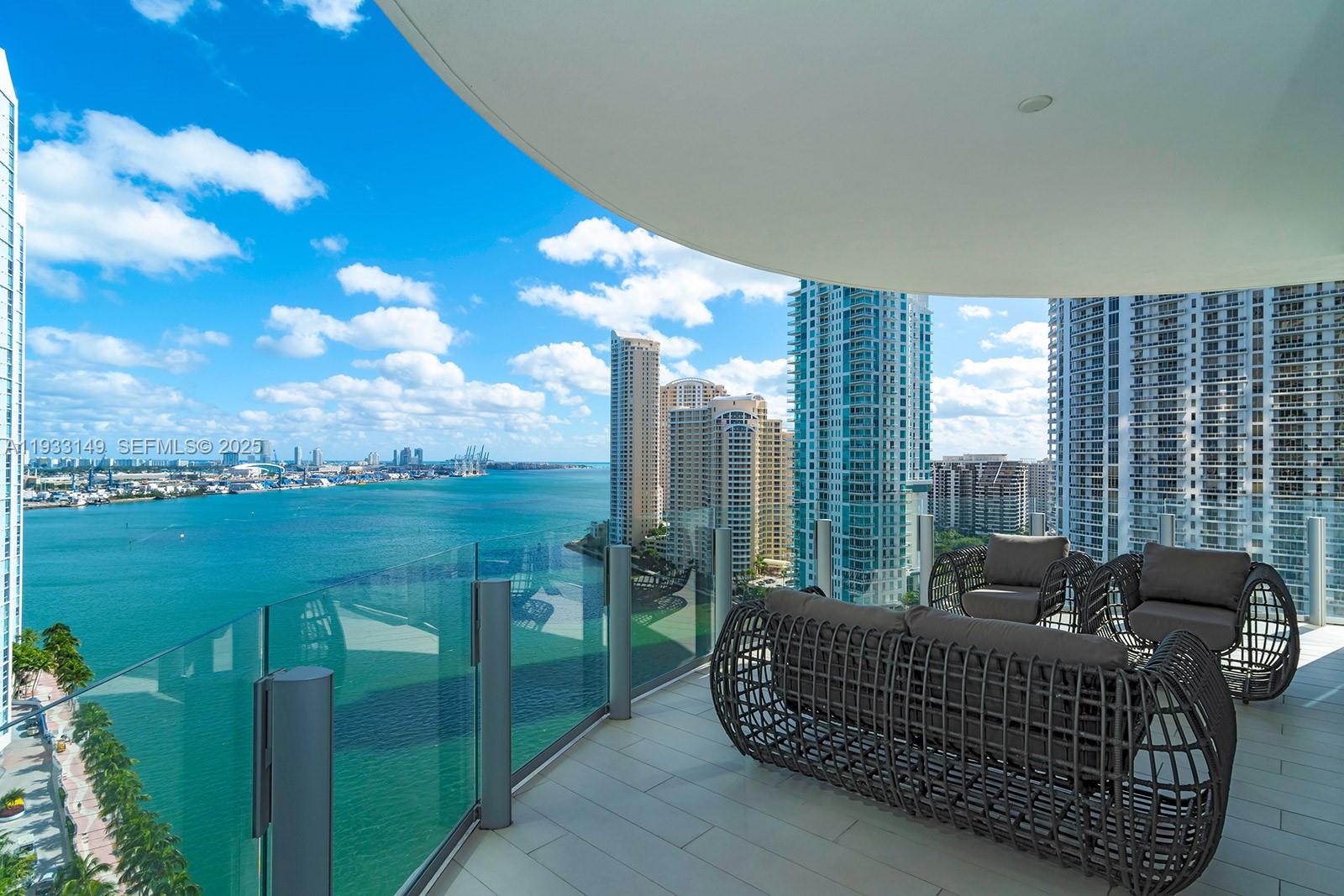 Residence 1901 offers a refined waterfront lifestyle in the iconic Aston Martin Residences. This east-facing corner home spans 3,865 sqft of interior space with 5 bedrooms and 5.5 baths, showcasing uninterrupted bay and Miami skyline views through floor-to-ceiling glass. The thoughtfully designed layout includes a gourmet kitchen equipped with Gaggenau appliances and a walk-in pantry, ideal for both everyday living and entertaining. The primary suite is a private retreat with dual spa-style bathrooms and two spacious walk-in closets. Residents enjoy access to approximately 43,000 sqft of resort-style amenities, including a two-level fitness center, sky pool, full-service spa, and curated social spaces, all within one of Miami’s most recognizable luxury towers. Furniture is negotiable.