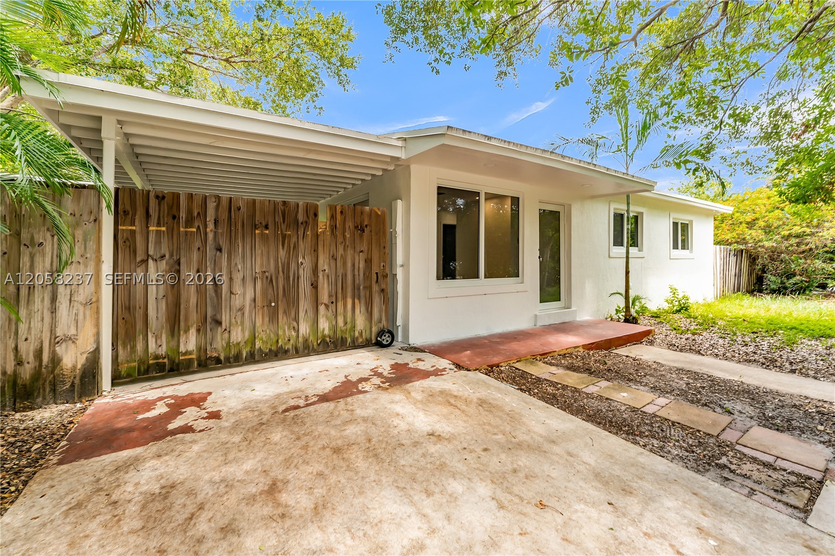 Beautifully remodeled 2-bedroom, 2-bath corner-lot single-family home in a desirable Broward neighborhood. This move-in-ready property has been completely renovated and features modern finishes throughout, a spacious patio perfect for entertaining, and a backyard with ample space to add a pool. Situated on an oversized 9,000+ sq. ft. lot, the home also offers peaceful lake views, fruit trees, and is located in a quiet, well-established neighborhood. No HOA! Whether you're looking for your primary residence, a vacation home, or a strong rental investment, this property is an outstanding opportunity in a prime location in Broward. Conveniently located just minutes from the beach, major highways, shopping, dining, parks, and top-rated schools, this home offers the perfect blend of comfort, convenience, and South Florida living.