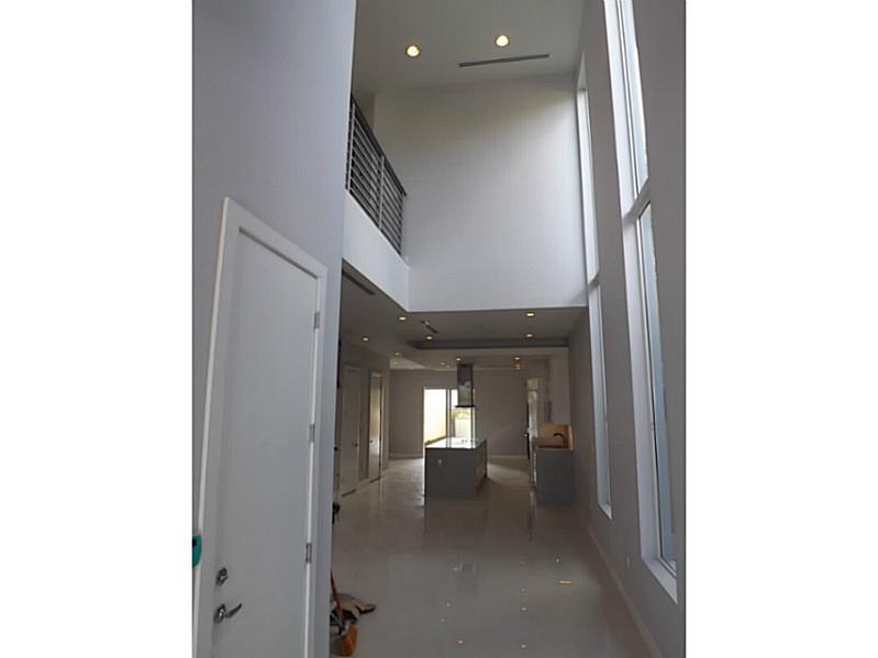 This property will not last! Its in the heart of the townhouse area in the Grove. New construction with modern theme. Has 3 bedroom, 4baths, single car garage, swimming pool, its completely gated. Has a beautiful roof deck. Must see to appreciate!