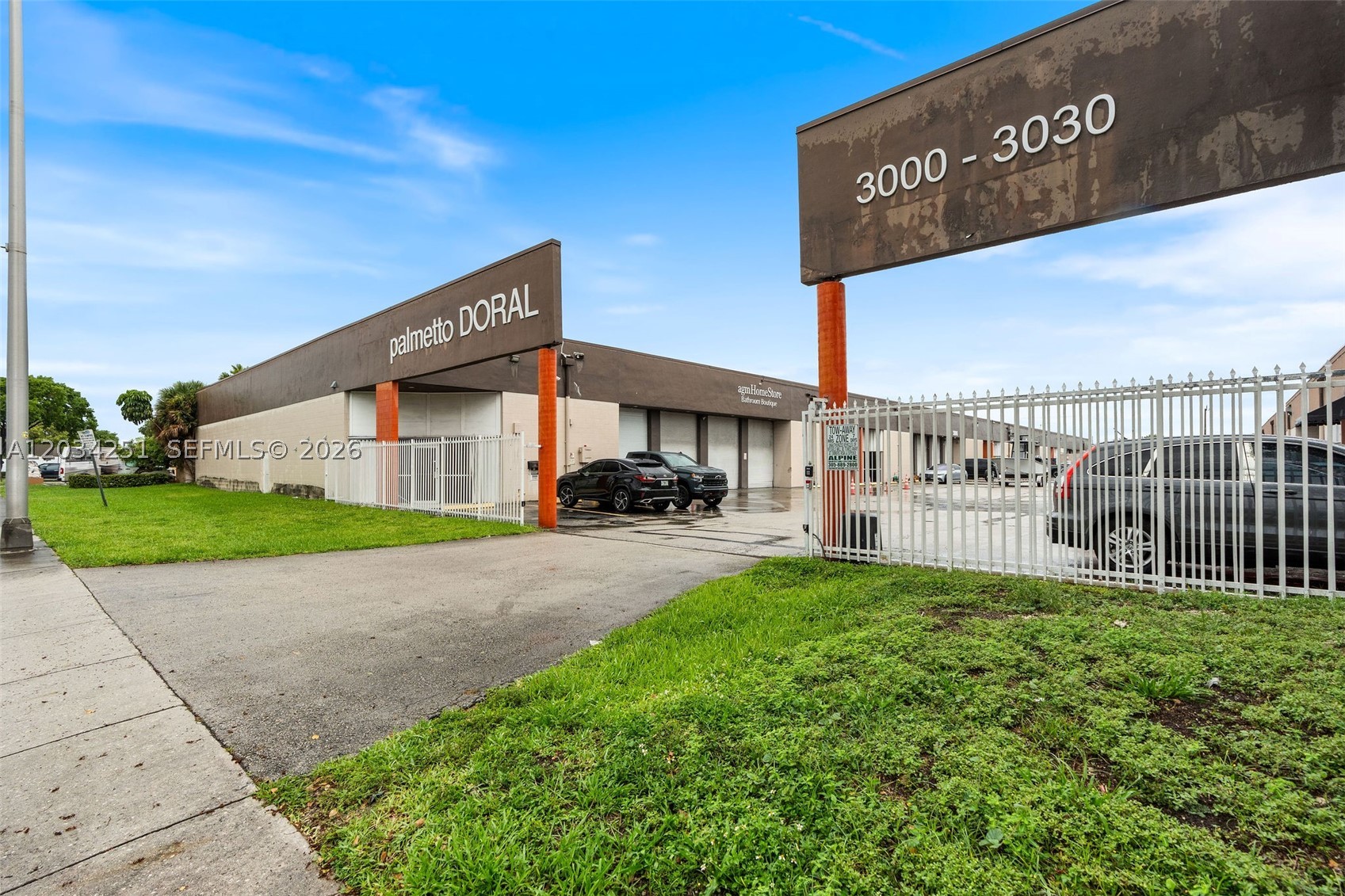 Versatile corner flex industrial unit in the Palmetto Doral Industrial complex with excellent visibility to NW 79th Avenue. The property offers a functional mix of warehouse, showroom, and legally permitted office space. Per approved plans, the property totals 6,005.29 SF, consisting of 4,490.39 SF of first-floor warehouse area, 831.70 SF of first-floor office/stair enclosure area, and 683.20 SF of existing legal mezzanine/office area. The warehouse offers high ceilings, concrete flooring, ample lighting, existing racking, and two grade-level loading doors for efficient operations. The upgraded office area includes reception, private offices, workstation areas, modern finishes, updated lighting, restroom, and utility/wash area. Gated industrial complex with prominent frontage, strong visibility, and excellent access to Palmetto Expressway, SR 826, Miami International Airport, and major logistics routes.