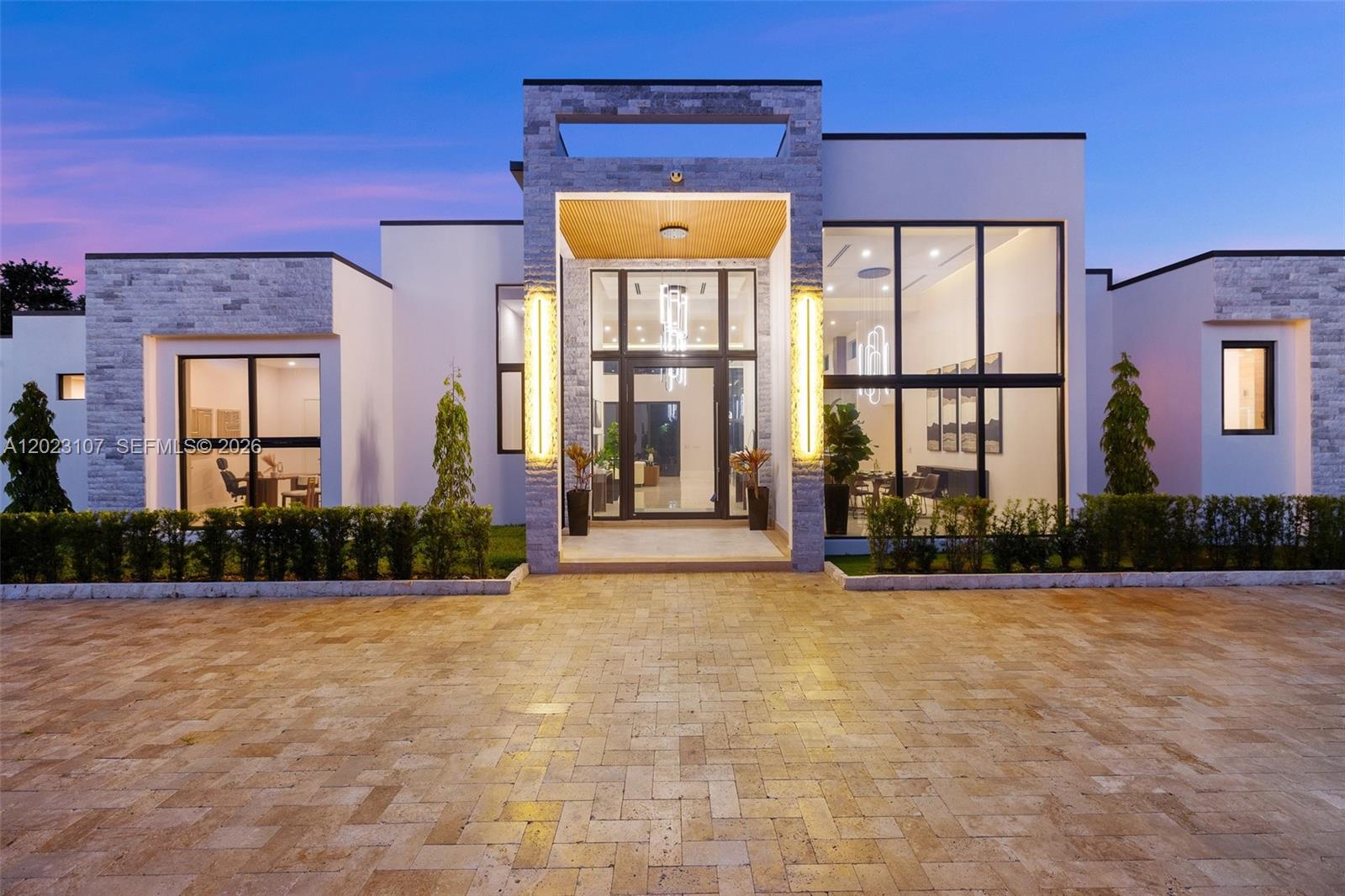 A rare offering that seamlessly blends scale, design, privacy, and modern luxury, this brand-new construction estate stands among the most exceptional residential compounds to come to market in Broward County.

Set on over 2 acres in Cooper City, this brand-new estate delivers 7,640 sqft across 7 bedrooms, 7 full and 1 half bathrooms — six with en-suite baths — including an 884 sqft guest cabana with 2 beds and 2 baths.

A glass pivot entry door opens to soaring double-height ceilings, polished marble floors, and Italian solid wood interior doors throughout. The open great room flows into a chef’s kitchen anchored by an oversized marble waterfall island, custom wood cabinetry, Wolf appliances, and Sub-Zero refrigeration. The primary suite features his-and-hers walk-in closets and a spa bath clad in marble, freestanding soaking tub, glass-enclosed rain shower, smart toilets, and marble vanities. Integrated throughout: Lutron lighting, Sonos audio on 4 independent channels, a 200” PT2 LED screen, and remote-controlled smart glass on every window and door. Motorized gates and full surveillance complete the package. A resort-style pool and spa sit on travertine pavers framed by a covered loggia.

A 3-car epoxy-floored garage, Lennox commercial-grade cooling, equestrian zoning, and a mature oak canopy framing over 93,000 sq ft of private grounds — few compounds in Broward County can claim this convergence of land, scale, and finish.