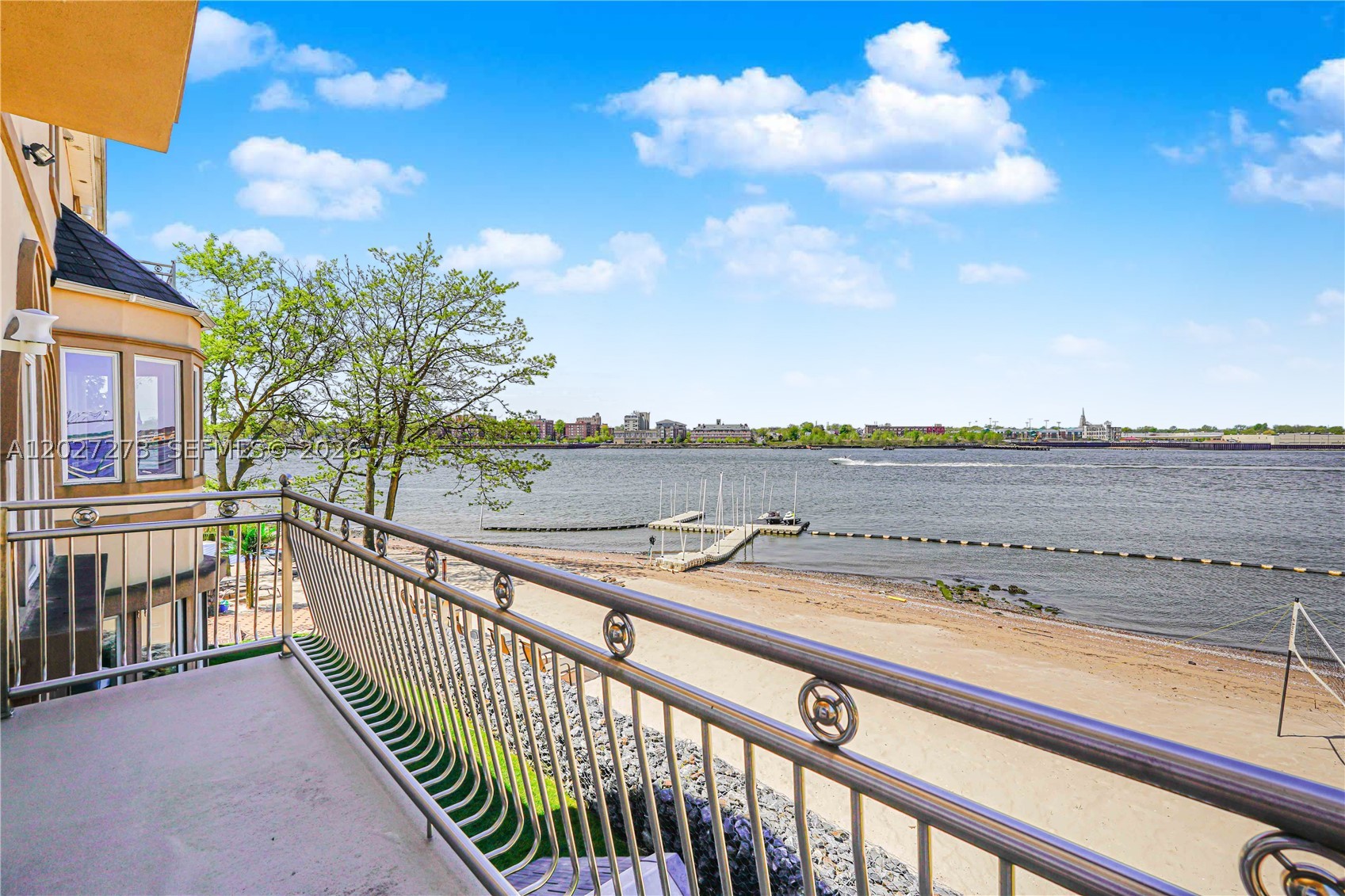 Exceptional 1.5-acre waterfront estate on Staten Island just 40 mins by boat to Manhattan. With 700 ft of water rights, this private oasis is a dream for boaters and beach lovers alike. Featuring 4 beds, 5 baths, 3 kitchens, cinema, gym, heated pool, and 5 ocean-view decks. Entertain outdoors with dual grills, wet bar, smoker, and TVs. Private dock fits 3 boats & 2 jet skis. Enjoy a sunset Jacuzzi, driving range, basketball court, and firepit. Ground-level suite offers a full kitchen, bar, and steam bath. Custom hardwood floors, solar panels, 400-amp electric, and whole-property Wi-Fi. Newer roof & lifetime warranty boilers. Seller is motivated, considering all offers w/proof of funds. Price negotiable.