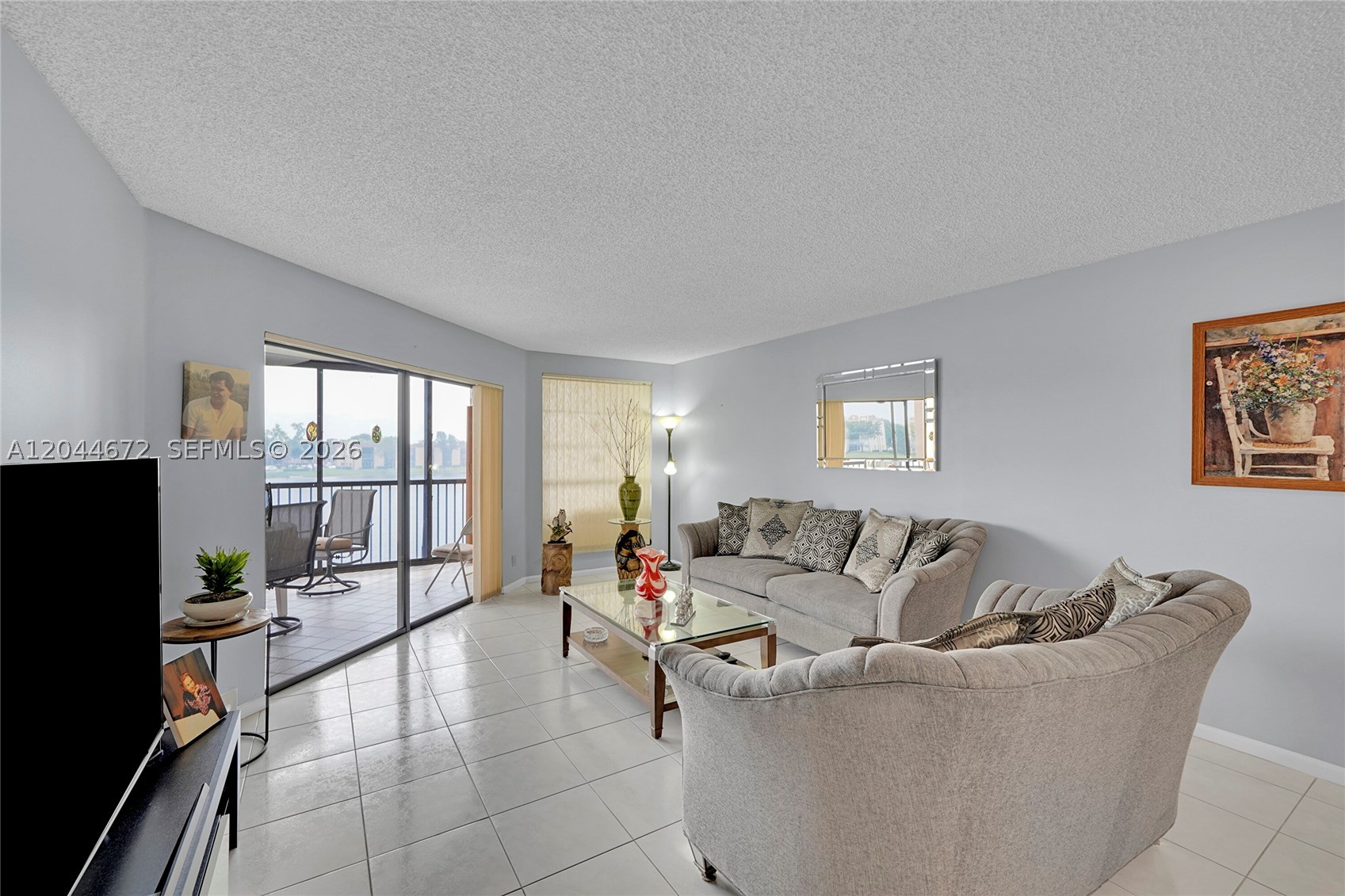 Welcome to the exclusive 55+ lakefront community, Kings Point of Tamarac! Conveniently located residence designed for those who value an active, fun and relaxing lifestyle. Resort style amenities including clubhouse, fitness, walking trails, pools, theater, tennis, art classes, performing arts, billiards, basketball, always a full calendar of social events & much more.. All just minutes from golf courses, shopping, dining, and Florida's pristine beaches. The home is bright with open-concept living space, high ceilings and very large windows to enjoy the water views. A spacious cozy primary suite with a standup shower, walk-in closet, dual sink, floor to ceiling windows & access to patio to enjoy your morning coffee. This is a must see! Easy to show.