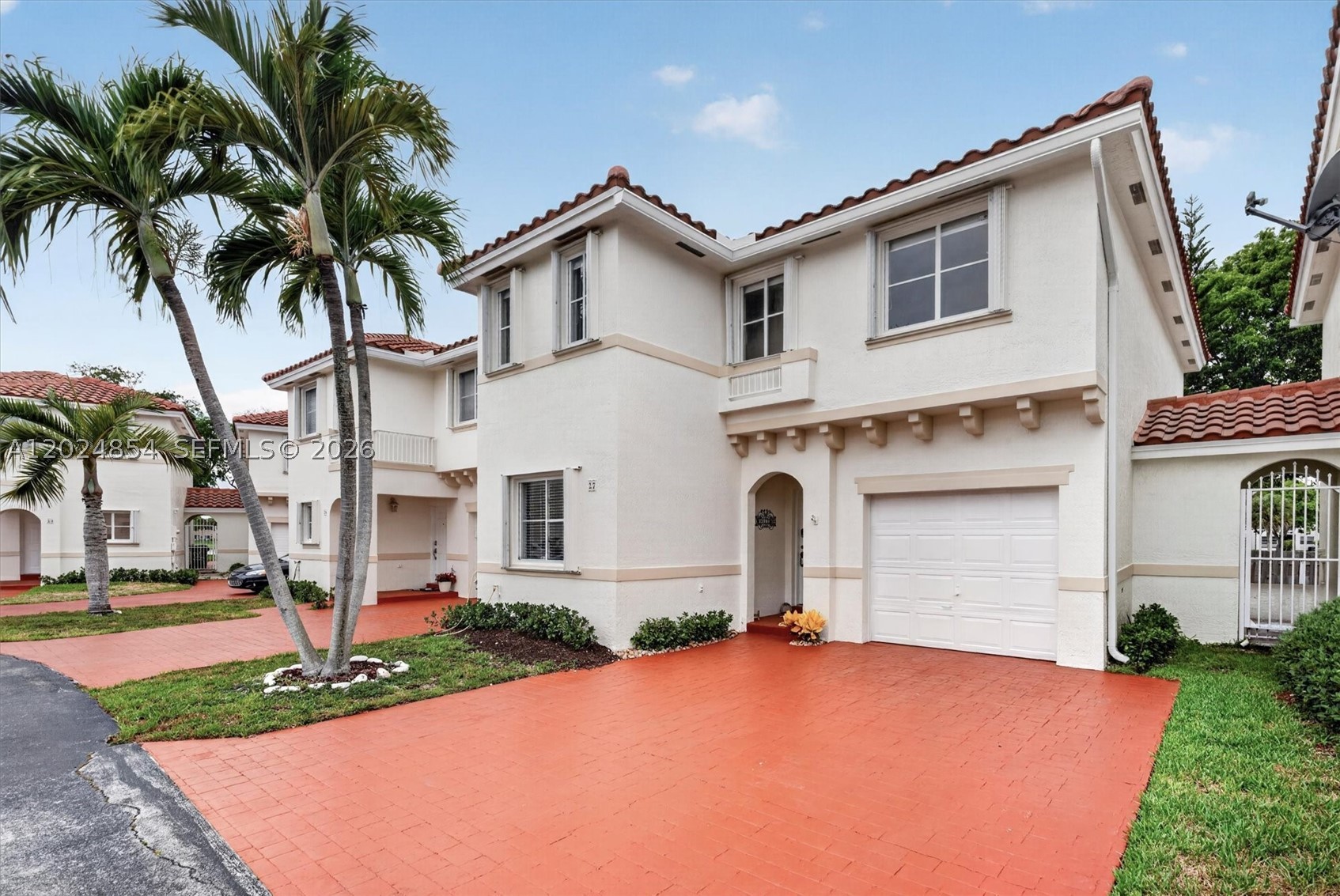 Lakefront living in one of the Hammocks’ most sought-after gated communities. This spacious two-story townhome at Mahogany Isles sits along a serene lake and delivers a long list of recent upgrades! Move-in ready.
The open layout features new engineered wood floors throughout, decorator paint, and a wood and granite eat-in kitchen with stainless Samsung appliances. Every closet is finished. The primary suite includes a walk-in closet, linen closet, and a newly renovated en-suite bath. The third bath features a new vanity cabinet. Indoor laundry. New blinds throughout.
Major systems are all updated: new central A/C (November 2025), tankless water heater (2025), and hurricane shutters for peace of mind. Outside, enjoy a newly gated patio with fresh landscaping. The community completed roof replacements (2024–2025) and exterior repainting (end of 2025) — meaning the big-ticket items are already done.
Residents enjoy resort-style amenities including a pool, jacuzzi, gym, clubhouse, and a beautiful lakefront walking pathway.
A rare opportunity to own a fully updated lakefront townhome in a well-maintained, gated community, all at an exceptional value.