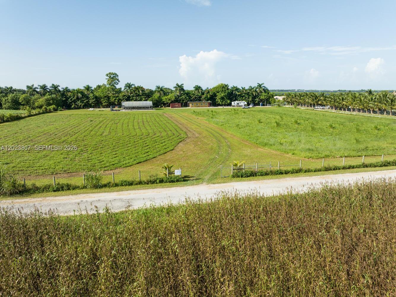 Exceptional opportunity to purchase 5 acres of versatile farmland, fully equipped for a variety of agricultural or operational uses. Property features two on-site wells and electricity running throughout. Improvements include multiple containers: one 53-ft container with A/C,  one 53-ft containers for dry storage, one 20-ft dry storage container, and a 40-ft fully built-out office container complete with electricity and air conditioning. Ideal for farming operations, nursery use, storage, or contractor yard. Ample space and infrastructure in place—ready for immediate use.