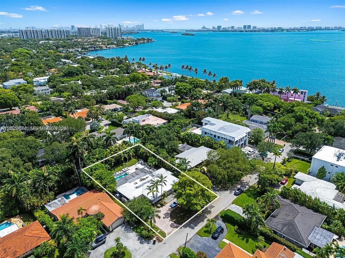 Live the Miami Shores lifestyle in this beautifully renovated 3BD/3BA residence set on an expansive 15,700 SF tropical lot just moments from Biscayne Bay, in the Bay Lure subdivision. Bright open living areas feature marble floors, skylights, abundant natural light, a working fireplace, and easy indoor-outdoor flow. The kitchen offers granite countertops and quality appliances, while the private backyard delivers true resort-style living with an oversized pool, covered patio, lush landscaping, barbecue area, and wood-fired outdoor oven. One-car garage plus circular driveway. A rare rental opportunity in eastern Miami Shores with space, privacy, and standout outdoor entertaining appeal.