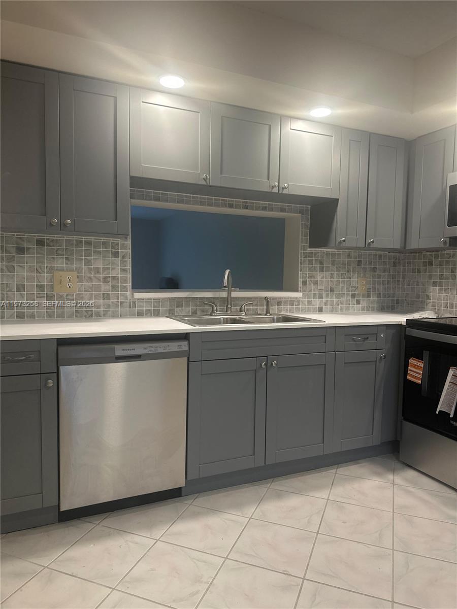 Don't miss this opportunity to own a spacious and bright 2 bedroom/2 bath unit in the resort-style adult community of Century Village. The unit features a brand new kitchen with stainless steel appliances, ceramic floor tiles in all rooms, fresh paint, new AC, and a screened patio with a gorgeous view of the golf course. The master suite has a large walk-in closet, and a separate vanity area that enhances privacy. Century Village offers residents an active lifestyle with a wide range of amenities, such as tennis, golf, pickleball, scenic walking and biking trails, and sparkling swimming pools in all sections. Residents enjoy convenient transportation by trolley that runs daily on a regular schedule. The magnificent clubhouse has an over 1000-seat theater that offers live entertainment and movies, a ballroom, a well-equipped gym, billiards, library, and conference rooms. There is a restaurant on site, as well as a medical center. Residents can join various organizations and social clubs, such as computer and art club. Association dues subject to verification.