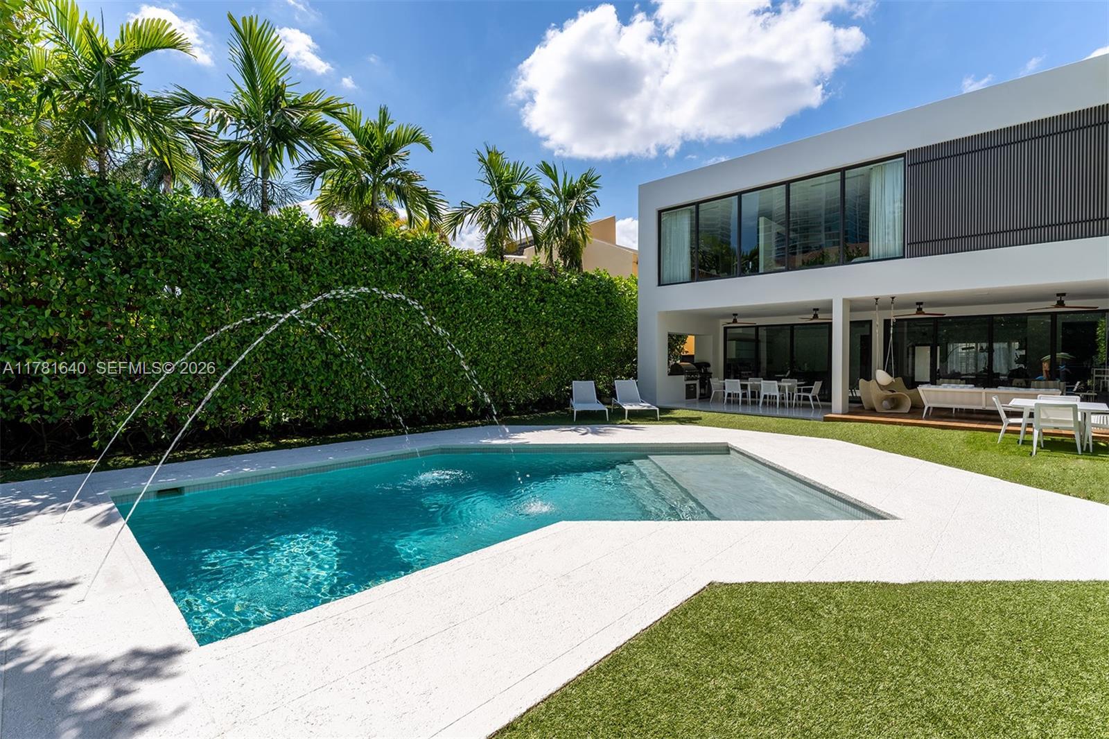 Behind a private gate, this modern home showcases a brand-new kitchen and a host of elegant updates throughout, complemented by high ceilings, a striking open balcony, and a thoughtfully designed main level with lavish tile and wood flooring. Upstairs, rich wood floors lead to ensuite bedrooms, including a lavish primary suite with oversized windows, a sprawling walk-in closet, dual vanities, and a spa-style tub and shower. Enjoy Jenn-Air and Thermador appliances, a gas range, Crestron automation, and Nest thermostat. The outdoor retreat features a heated pool, covered patio, gourmet summer kitchen, lush landscaping, and a gym/cabana. Plus, a 1-car garage and upstairs laundry offer added convenience. Just a 10-minute walk to all that Brickell Ave has to offer.