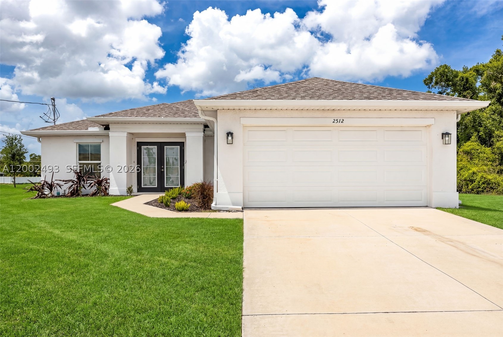 PRICED TO SELL QUICKLY! Step into modern Florida living with this like new 2023 construction home, ideally positioned in a desirable area of Cape Coral and ready for its next owner. From the moment you arrive, the double door entry creates a grand first impression, leading into a bright open concept great room designed for both everyday living and easy entertaining. Natural light fills the home, highlighting clean modern finishes and a seamless flow throughout. The kitchen is the heart of the home, featuring quartz countertops, ample cabinetry and generous prep space, perfect for gatherings or quiet evenings. A split bedroom layout offers privacy and functionality, while all four bedrooms provide comfortable space for family, guests or a home office. Laminate wood look flooring throughout adds durability, style and easy maintenance. Step outside to a large backyard with plenty of room for a pool or your dream outdoor retreat. Located just a short drive from Pine Island for boating, waterfront dining and island hopping and within reach of Southwest Florida’s white sand Gulf beaches, this home delivers the lifestyle buyers want. Move in ready with the feel of new construction, this spacious four bedroom property checks all the boxes, schedule your private showing today and experience the best of Florida living.