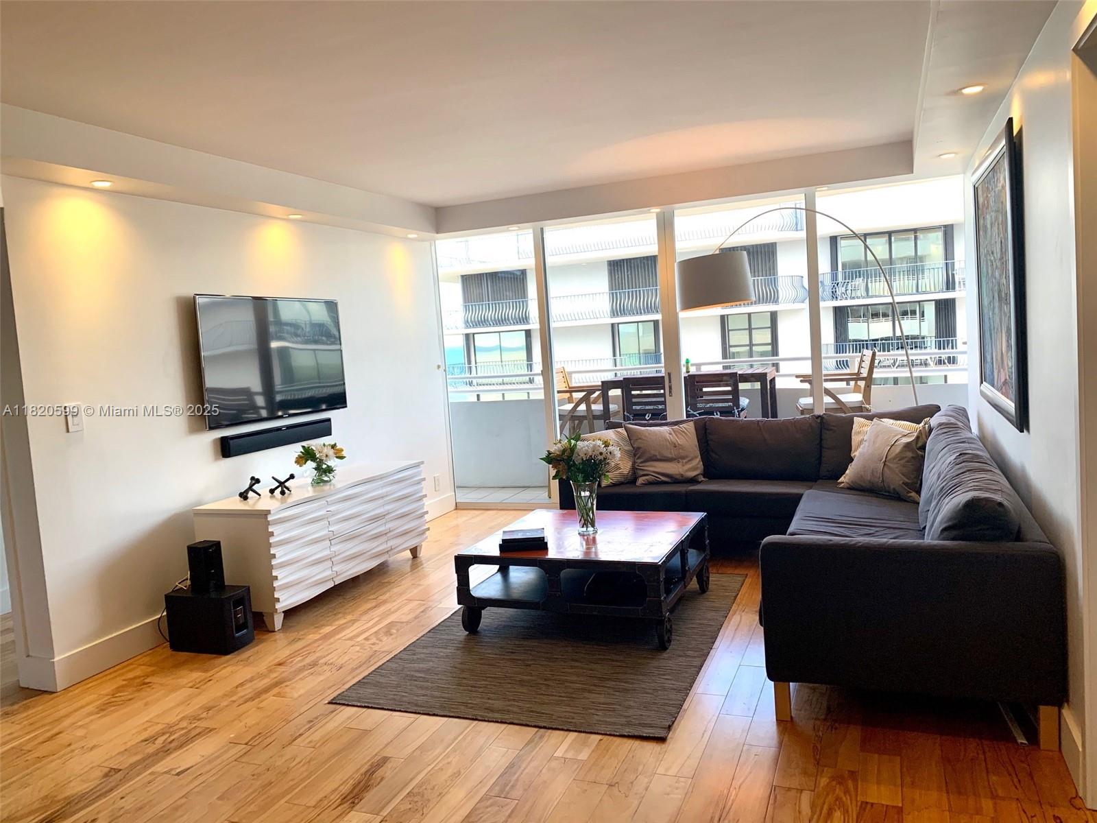 Discover elevated beachfront living in this modern, elegantly remodeled 2-bed/2-bath apartment on the 11th floor. Your private balcony presents stunning, expansive views of the ocean, bay, and city. Inside, enjoy wood floors throughout, a spacious master suite with custom walk-in closet, and a large master bath shower. The custom Stosa kitchen feat. Bosch & Liebherr stainless steel appliances and quartz countertops. Convenience is paramount with motorized shades in the family room, plus in-unit internet, washer, and dryer. This building, a design marvel by Arquitectonica, offers direct beach access and an ideal location. You're moments from Bal Harbour Shops, supermarkets, the Surfside community center, parks, and religious establishments within an outstanding, family-friendly area.