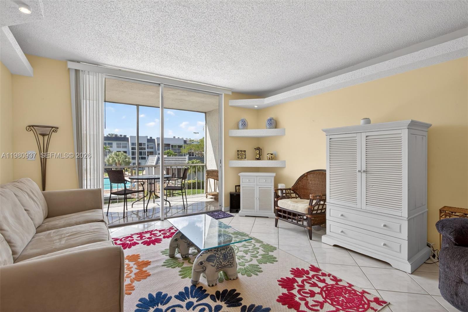 Move-in ready 1-bedroom, 1.5-bath condo with pool and garden views in the 55+ community of Royal Park Gardens in Margate. Bright second-floor unit featuring tile flooring throughout, open kitchen, spacious living/dining area, and screened balcony overlooking the pool and landscaped grounds. Bedroom includes walk-in closet and plenty of natural light.
Community amenities include heated pool, clubhouse, fitness room, tennis courts, shuffleboard, BBQ/picnic area, common laundry and storage unit. Maintenance covers water, basic cable, pest control, and common areas. Conveniently located near shopping, dining, medical facilities, and public transportation.