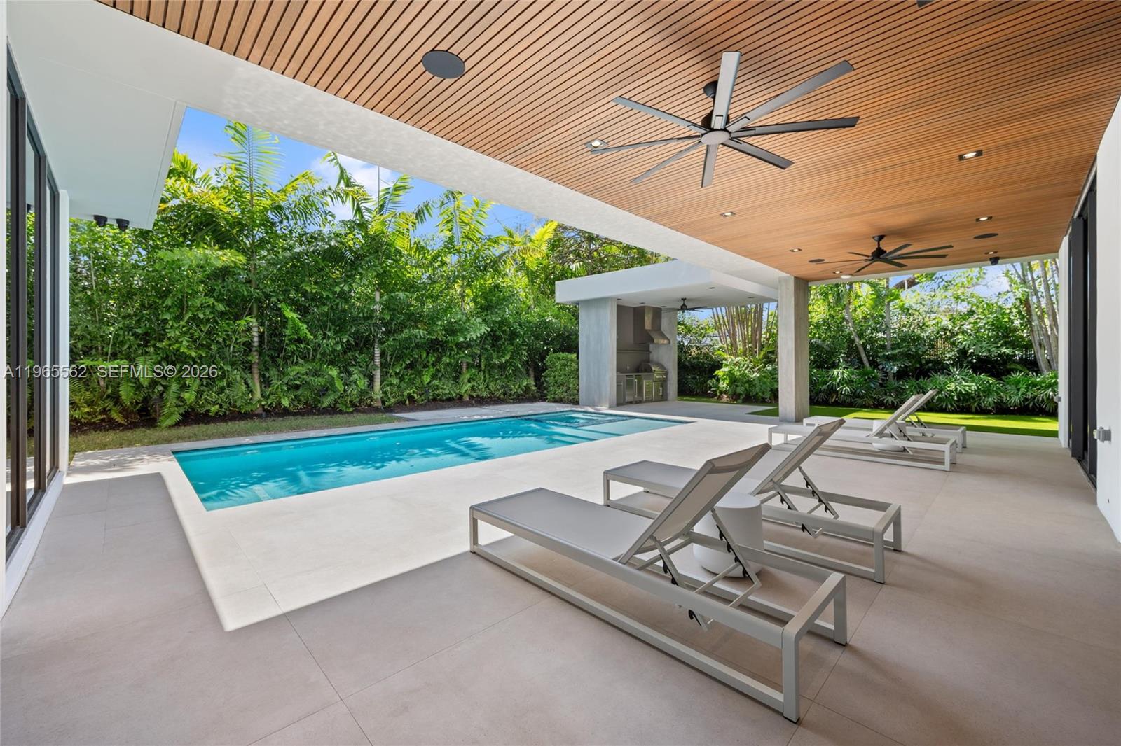 Welcome to this modern residence in Bay Heights, one of Coconut Grove’s most exclusive enclaves with 24/7 police monitoring. 9000 sf beautiful lot with privacy and without a neighboring house in the back. This six-bedroom, six-bathroom home is thoughtfully designed for today’s luxury lifestyle, blending clean architectural lines with warm, sophisticated finishes throughout. The heart of the home is a custom Italian kitchen outfitted with Miele appliances and natural gas, perfectly suited for both everyday living and elevated entertaining. Expansive living spaces flow seamlessly to the outdoors, creating an effortless indoor-outdoor experience ideal for Miami living. The second level features four spacious bedroom suites, each with walk-in closets, offering privacy, comfort, and a true sense of retreat. Outdoors, a saltwater pool and spa, lush landscaping, and a separate gazebo with BBQ create a private oasis for relaxation and entertaining year-round. Additional highlights include a two-car garage plus two-car carport, smart design details, and exquisite finishes throughout. This is a rare opportunity to own a move-in ready luxury home in the heart of Coconut Grove—where elegance, security, and lifestyle come together effortlessly.