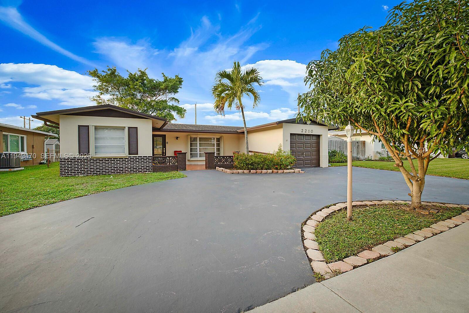 Rare opportunity to own one of the largest homes in this desirable Pembroke Pines neighborhood. This spacious 3-bedroom, 2-bath,one car garage residence offers approximately 2,377 square feet of living space, making it a true standout in the area. The thoughtfully designed open-concept layout features a seamless dining and living area ideal for entertaining, along with an expansive open family room that serves as the heart of the home. The updated kitchen and bathrooms showcase modern finishes, while a newer roof (2014) adds long-term value and peace of mind. With a versatile floor plan offering the potential to convert to up to 5 bedrooms, this home provides exceptional flexibility. Accordion shutters throughout enhance both convenience and storm protection. Enjoy a beautifully sized backyard with no rear neighbors—backing to a serene open field for added privacy and tranquil views. No HOA, offering complete freedom and convenience. Circular driveway with room for multiple cars leads to a 1 car garage.