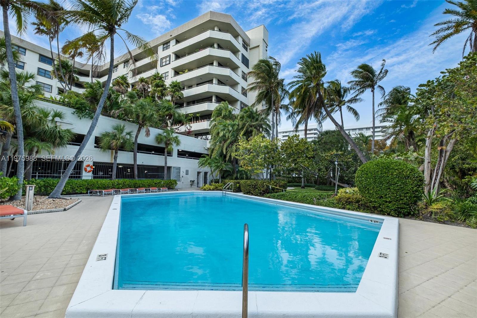 Welcome to this bright and inviting 2-bedroom, 2-bathroom condo in the highly sought-after Ocean Lane Plaza, a resort-style community in the heart of Key Biscayne. This well-appointed residence features bright tile flooring throughout the living areas and a large living and dining room combination with wet bar, creating an open and comfortable space perfect for both relaxing and entertaining. The spacious primary suite includes a walk-in closet and an en-suite bath with a separate shower and soaking tub. The galley-style kitchen offers a convenient breakfast bar, ideal for casual dining. Step out onto the large, covered balcony and enjoy peaceful views of the beautifully landscaped grounds. Ocean Lane Plaza offers an exceptional lifestyle with resort-style amenities including a sparkling pool, hot tub, fitness center, party room, and 24-hour security. Ideally located just steps from the beach, parks, shops, and dining, this condo is perfect as a full-time residence, vacation getaway, or investment opportunity. All information recorded in the MLS is intended to be accurate but cannot be guaranteed, buyer advised to verify. Sold As-Is