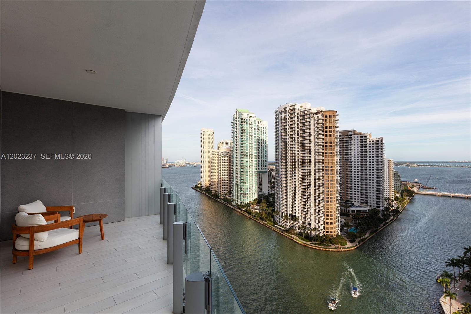 Waterfront Living at Aston Martin Residences
Set within Aston Martin Residences, Unit #2107 is a refined Downtown Miami waterfront offering defined by private arrival, sculptural architecture, and a crescent-shaped floor plan that follows the building’s curved glass façade. Located on level 21 within the Panoramic Residences collection, the 3 bedroom, 3 full and 1 half bathroom home offers a total of 2,619 SF+/- living space, including 2,462 SF+/- of interior space and 157 SF+/- of exterior space. A private elevator opens to a dedicated lobby, establishing a discreet arrival experience before the plan unfolds toward open living spaces, floor-to-ceiling glass, and layered views of Biscayne Bay, the Miami River, Brickell Key, and the Downtown Miami skyline.
Unit #2107 brings together the architectural identity of Aston Martin Residences with a thoughtful 3-bedroom layout, private elevator access, a dedicated lobby, a waterfront terrace, 2 parking spaces, and a crescent-shaped plan that maximizes light, flow, and views. The result is a complete Downtown Miami offering shaped by privacy, service, and the rare experience of living within one of the city’s most recognizable waterfront towers.