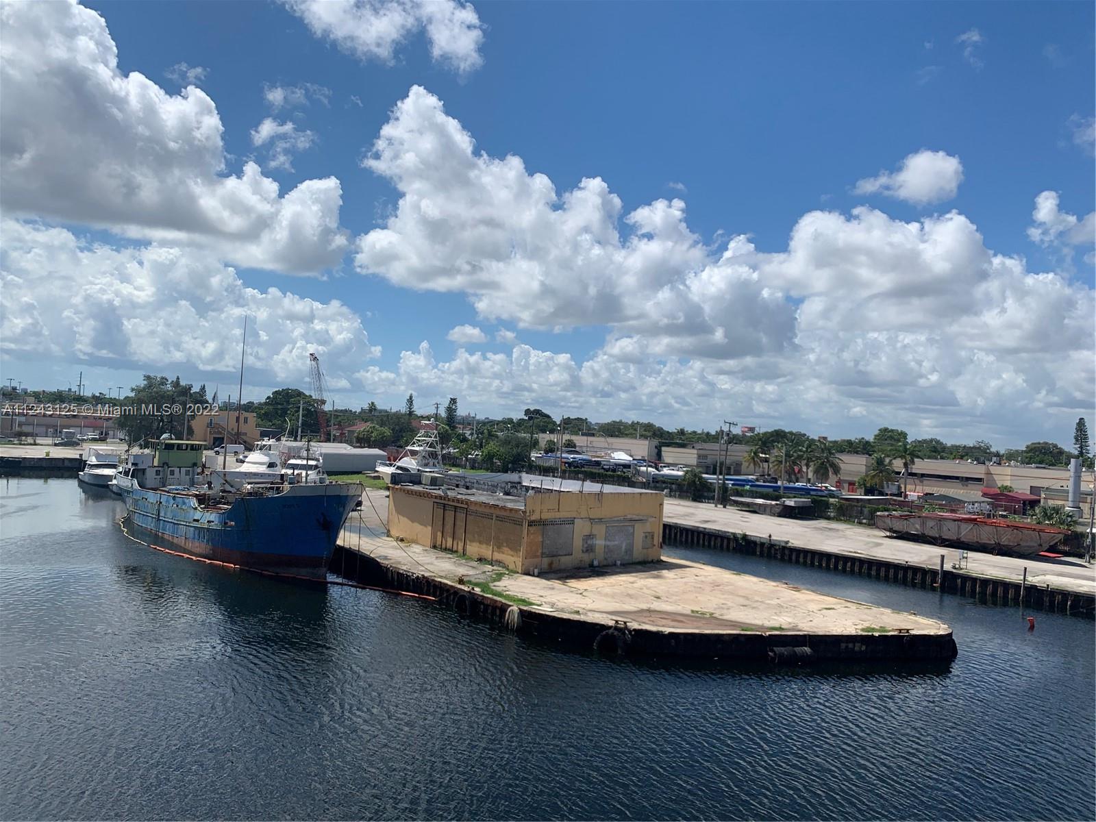 Beautiful Marina with 2 slips next to 22nd Ave bridge, Includes 2 story office and or storage, 1 concrete ware house  on the front, and 2 hangars. Zoned D3.