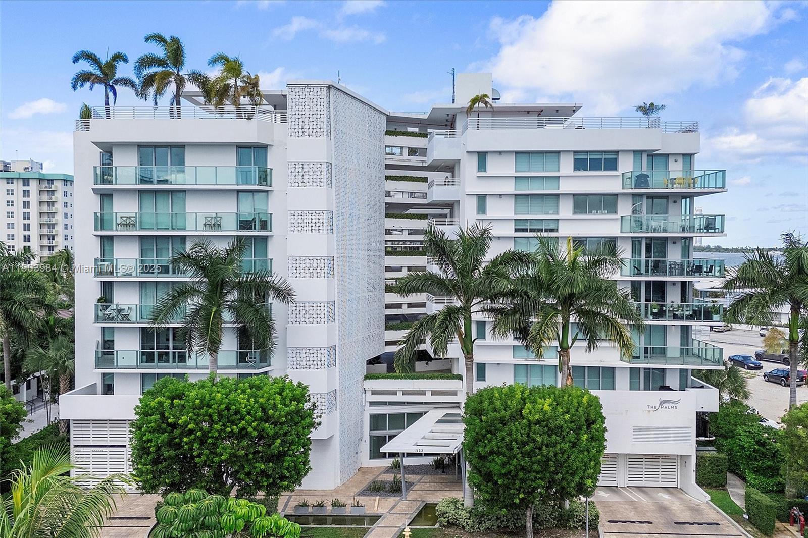 Find your zen in this beautifully curated 2-bedroom, 2-bath residence at The Palms, a boutique building in the heart of Bay Harbor Islands. Floor-to-ceiling windows fill the space with natural light and lead to an oversized terrace perfect for relaxing or entertaining. Enjoy tasteful designer finishes, custom wallpaper, and a calm, contemporary aesthetic throughout. This home includes two garage parking spaces. Building amenities feature a rooftop pool, BBQ area, and peaceful ambiance. Ideally located near Bal Harbour Shops, the beach, A+ rated K-8 School, fine dining, and markets offering the perfect blend of tranquility and convenience in one of Miami’s most desirable island communities. Parking spaces 81 & 82 in lower garage.