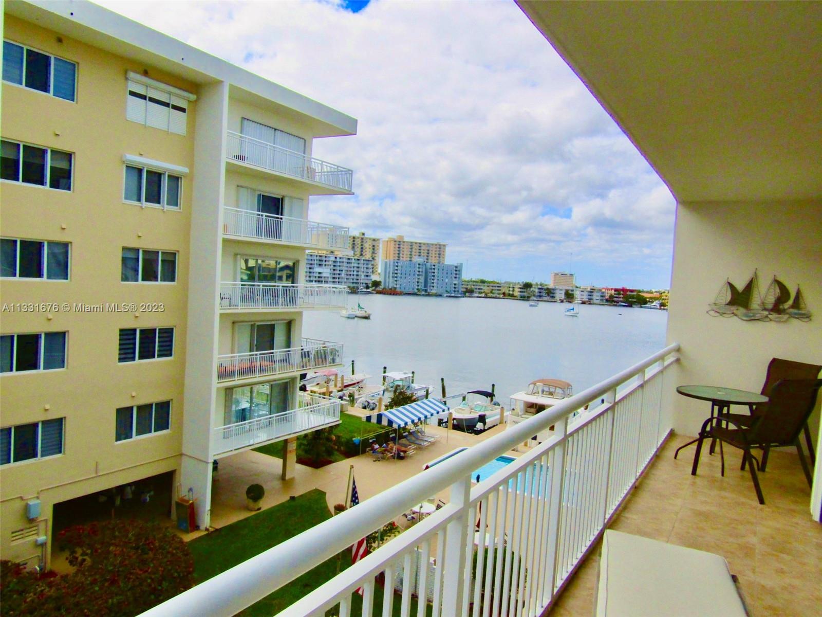 Impeccable corner unit with an amazing Panoramic water view from a wrap around balcony overlooking water on both sides. Completely remodeled unit with open concept kitchen, granite countertops, stainless steel appliances, wood cabinets, tankless water heater, recessed lighting, renovated bathrooms with modern vanities, large pantry. Impact windows and accordion shutters on balcony doors. Two assigned storage spaces and free laundry on each floor. The building is designed with privacy in mind as there are only 4 units per floor with wrap around balconies. May contact HOA for boat dock leasing. 40 years certification done. One mile from the beach, close to shops, restaurants and Gulf Stream Racetrack. Building lobby was recently remodeled.
