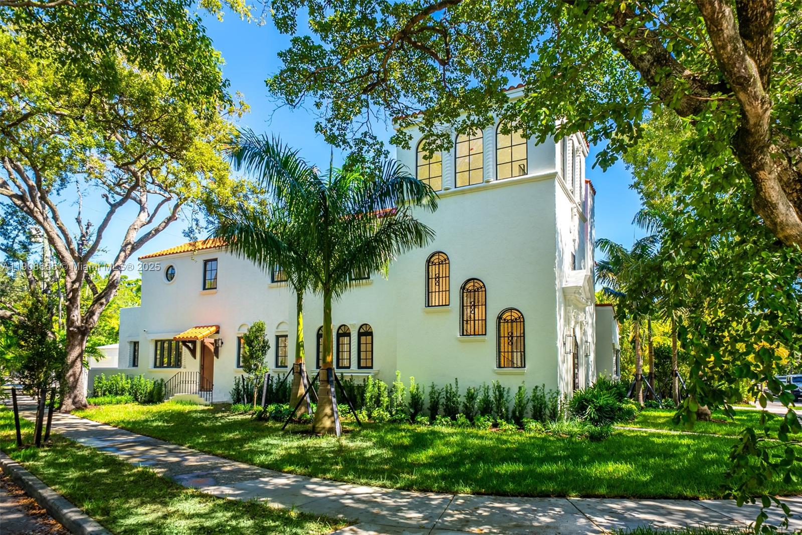 This remarkable 1920s Mediterranean historic home has been fully renovated, offering 7 bedrooms, 6/2 bathrooms, and over 5000 total SqFt. Florida’s 2nd registered woman Architect, Marion Manley—who also designed University of Miami’s Campus—was the original Architect for this home. Highlights: Brand New Kitchen, Primary Suite, Guest Rooms, Balcony, Laundry Room, and Outdoor Dining Terrace on the 2nd Floor. Expansive living room with wood beams, fireplace also opens to a covered outdoor dining area. The private inner courtyard is an entertainer’s delight, complete with a Spa. Rare 3rd floor loft with 360 degrees of natural lighting can be your ideal study. New Hurricane Impact windows, new Oak Floors/Stone Tiles, Custom closets for each bedroom. Call listing agents for appointments.