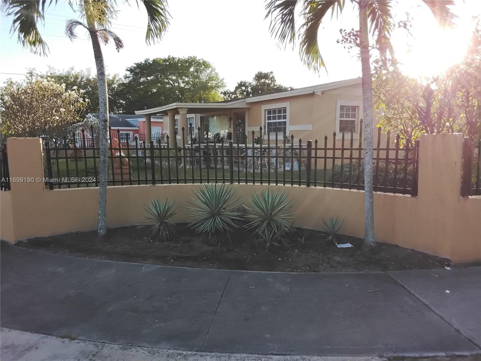 CASH ONLY BEAUTIFUL HUGE CORNER HOME WITH AMAZING CURB APPEAL, LARGE FAMILY ROOM, LARGE ENCLOSED PATIO, LARGE YARD AND A LARGE FRONT PORCH to enjoy.  This home also has a LARGE KITCHEN with a separate storage and laundry room.  Outside you will find a very spacious front, side and backyard for lots of family functions.  This dream home is just a 10 MINUTE WALK TO HARD ROCK/DOLPHIN STADIUM!!! ALSO PERFECT FOR AIR BNB!! NO HOA!!!  NO RESTRICTIONS!!!  LOTS OF PARKING!!!  PERFECT FAMILY HOME!!!  SMART INVESTORS THIS IS YOUR NEXT DIAMOND!!!  THIS HOME CHECKS ALL OF THE BOXES!!!