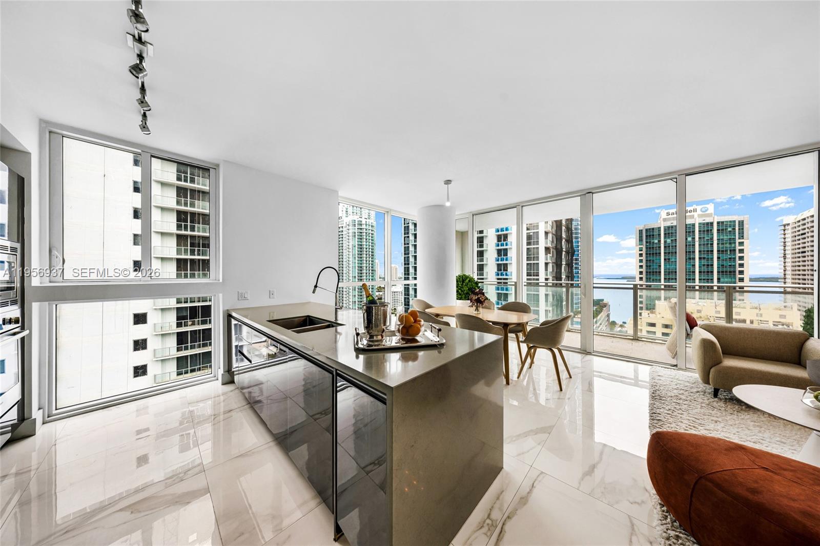 Beauty at The Bond in Brickell! Enjoy spectacular bay & skyline views from this high-floor 2-bedroom, 2-bath corner residence in a full-service building at the center of Brickell’s financial district. This light-filled residence features white porcelain floors, built-out closets, and an extended oversized balcony—perfect for indoor-outdoor living and entertaining above the city.

The open kitchen is equipped with sleek Bosch appliances and flows seamlessly into the living space, creating a modern and functional layout. Thoughtful finishes and floor-to-ceiling windows enhance both comfort and style.

Residents enjoy resort-style amenities including a luxury pool, spa, barbecue area, 24-hour concierge, and valet services—offering the ease and convenience of true full-service living. 1 assigned parking.

Brickell is one of Miami’s most sought-after neighborhoods, known for its vibrant energy, walkability, and unmatched access to dining, shopping, and nightlife. Just minutes from Downtown Miami, the Design District, Miami International Airport, and the beaches, Brickell offers the perfect blend of urban sophistication and waterfront lifestyle. Ideal as a primary residence, pied-à-terre, or investment opportunity in one of Miami’s most dynamic locations.