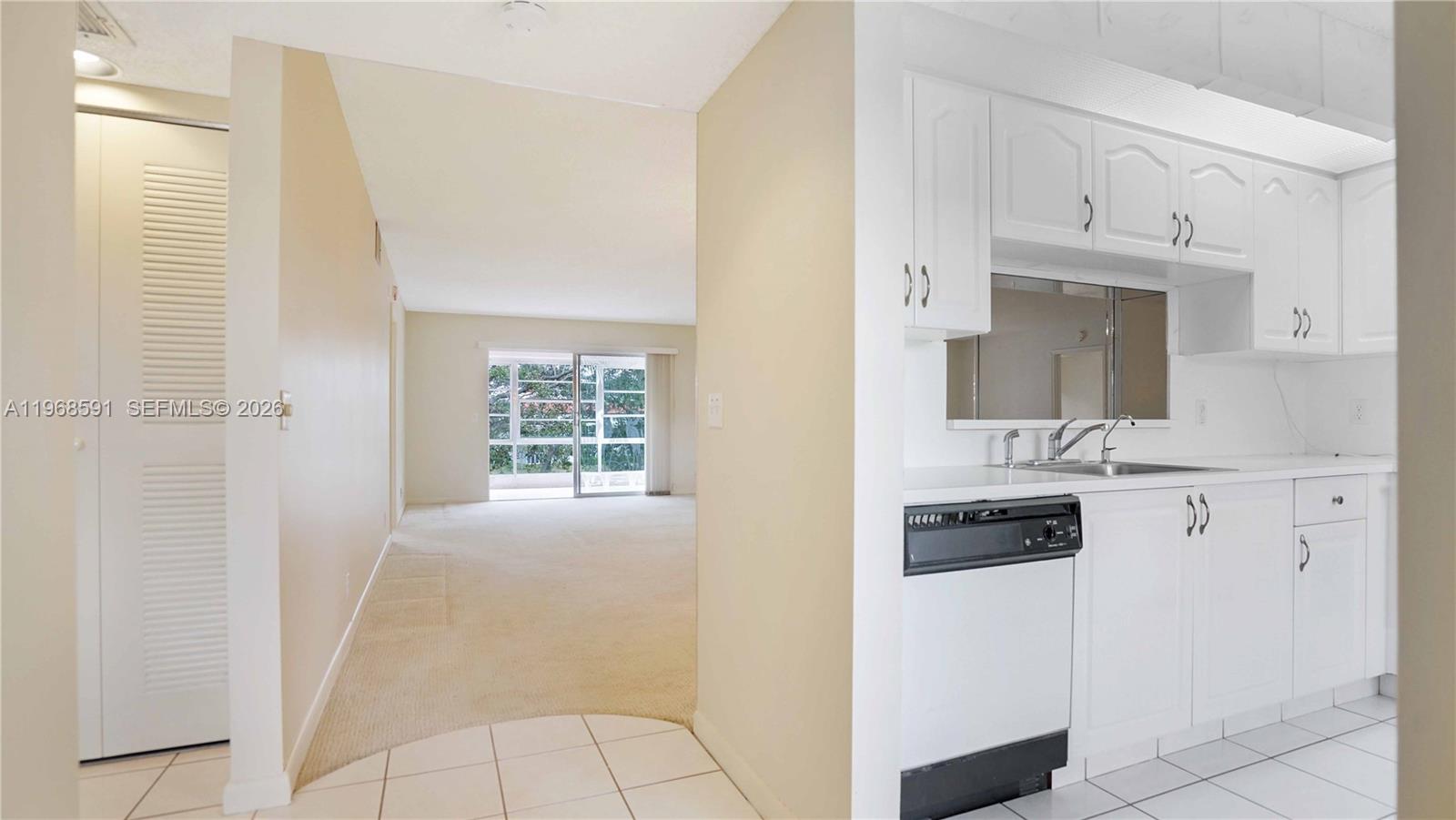 Enjoy a serene lake view from this charming 2-bedroom, 2-bath condominium in the highly sought-after Century Village Pembroke Pines community. This light and bright home features an etched glass sliding door leading to the patio, creating an elegant transition to a tranquil lake view, plus the convenience of an inside washer and dryer. The open layout offers generous living space and storage, perfect for comfortable Florida living.  Century Village offers resort-style amenities including clubhouse, pools, fitness center, tennis, theater, and courtesy transportation. Ideally located close to shopping, dining, and medical facilities—this is South Florida living at its finest!
