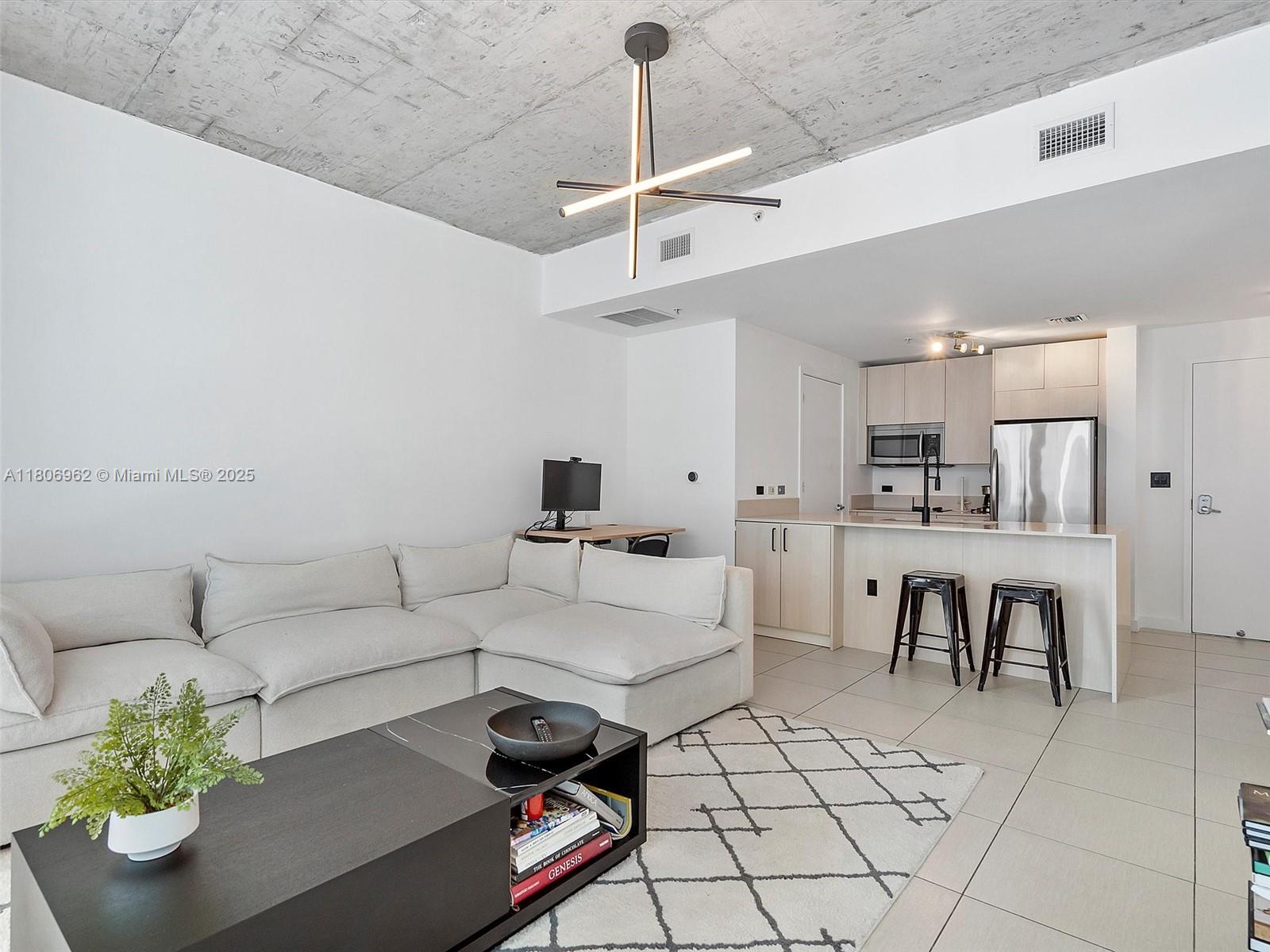 This unit at Four Midtown offers a spacious 1-bedroom and 1.5-bathroom layout. The floor-to-ceiling windows provide ample natural light and a guest bathroom and laundry room for added convenience. The unit also boasts a large balcony, perfect for enjoying the outdoors. The assigned parking space is conveniently located on the same floor as the unit. Residents can enjoy the vibrant lifestyle of Midtown and access the building's top-notch amenities Also available unfurnished. NOT AVAILABLE TO SHOW UNTIL JUNE 15